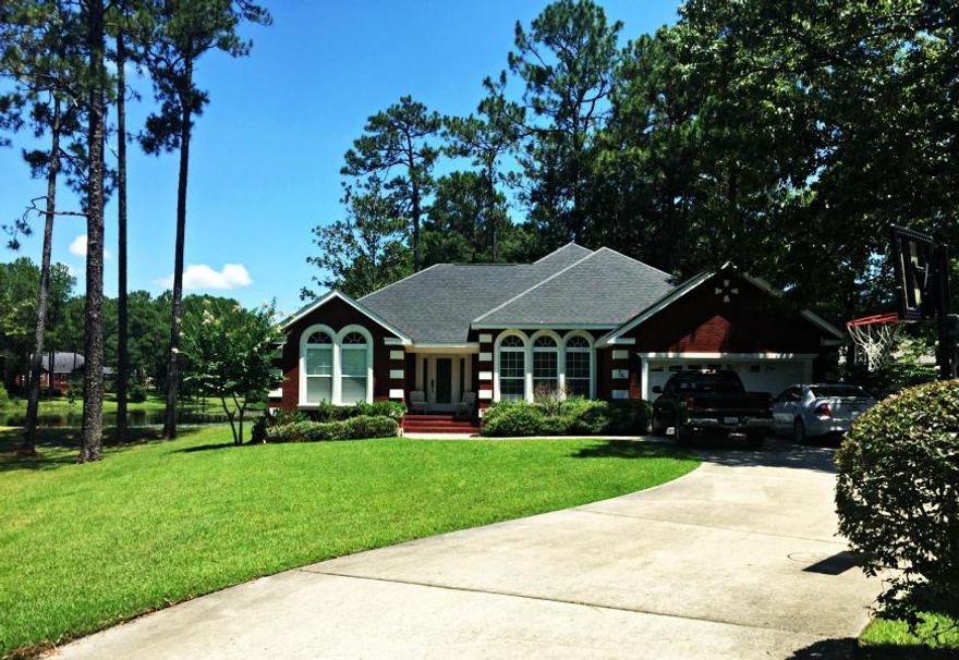 Waterfront at it's finest! This gorgeous executive style, custom home is located in the highly desirable neighborhood of Pine Shores. With 75 feet of water frontage, this home has lake views from almost all rooms. The floor plan was made with convenience in mind with a very easy flow of being open but still separated. The living room is very large, boasting beautiful trey ceilings and fireplace. The kitchen features upgraded cabinets with plenty of space for the chef in the family. There is a formal dining room on one side of the kitchen and on the other is a breakfast room overlooking the water. The spacious master suite has a great master bathroom with double vanity, separate shower and soaking tub. Also, lots of storage space in the 2 car garage. There is a large closet and plenty of storage in the attic. The current owners have added flooring in the attic space. Buyer must verify all measurements. Schedule your showing today!