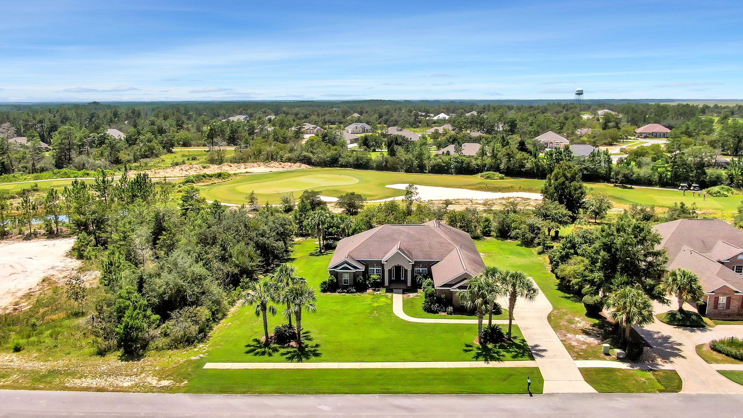 This 4 bedroom, 3 bath home is situated on a beautifully landscaped lot that backs up to the 16th hole in Windswept Estates. The moment you enter this exquisite home, you will be greeted with elegant style, including tile floors and new LVP throughout the bedrooms, upgraded media wiring, granite counter tops, maple cabinets, upgraded shelving in each closet, security system, two HVAC units, two gas water heaters, a large screened in back porch with brick pavers, gas fireplace, 3 car garage, plus so much more. Windswept Estates is a 750 acre master-planned residential community and a premier gated golf course. Amenities include a large swimming pool and clubhouse, two tennis courts, basketball courts, and a playground - the perfect place to call ''HOME''.