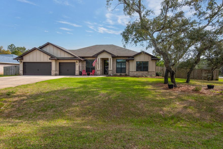 Welcome to 6703 Britt St, Navarre, FL 32566, a stunning residence nestled on a large, .57-acre dry corner lot in the desirable community of HBTS. As you step onto the property, you'll be greeted by a fully fenced-in yard, offering both privacy and security for you and your loved ones.The outdoor space is a true oasis, featuring a large covered and screened patio with elegant tile flooring. This expansive 518 sq ft area extends to a 190 sq ft covered patio, providing the perfect setting for outdoor gatherings or tranquil relaxation. What's more, the patio is built by Titan Sunrooms and is ''hurricane rated,'' ensuring durability and peace of mind during inclement weather.