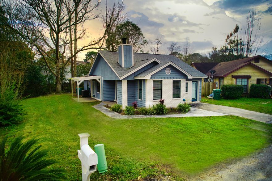 HONEY, STOP THE CAR!!  This is the only 3 bedroom home on the street.  Totally updated within the past 5 years, including the roof. Walk in the front door and take in the open living space which includes the living room, with a wood burning fireplace, dining area and updated kitchen.  Sliding glass doors on the kitchen and primary bedroom allow you to take in the surrounding nature.  There are no houses behind the property so you have privacy.   There is also a covered patio off of the side of the home.   Thanks to a tree in the backyard, the seller is making some repairs, which will be completed prior to closing.  Don't let that discourage you though, this is a great house in a great location just waiting for its new owner to enjoy.  Call now before it is gone!