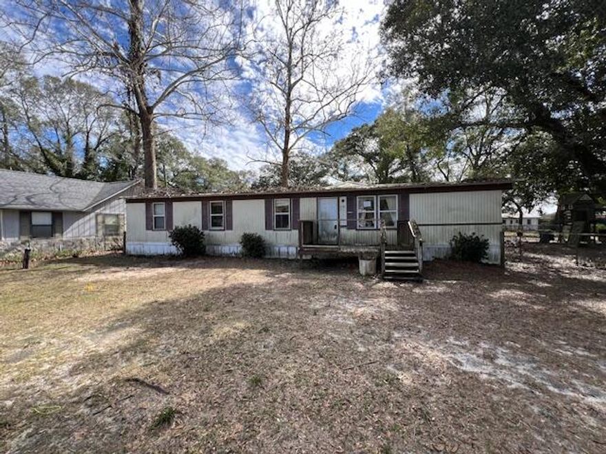 Located midway between Niceville and Freeport, this conveniently located REO Mobile is ready for some elbow grease. Built in 1980, this 3 bedroom 2 bath modified mobile is just under 1500sf and has large living and kitchen space along with an addition to the back of the home, which has added to the square footage. Due to the condition of home, only selected rehab loans and cash only. Home will not qualify for typical financing. Call today for more details!