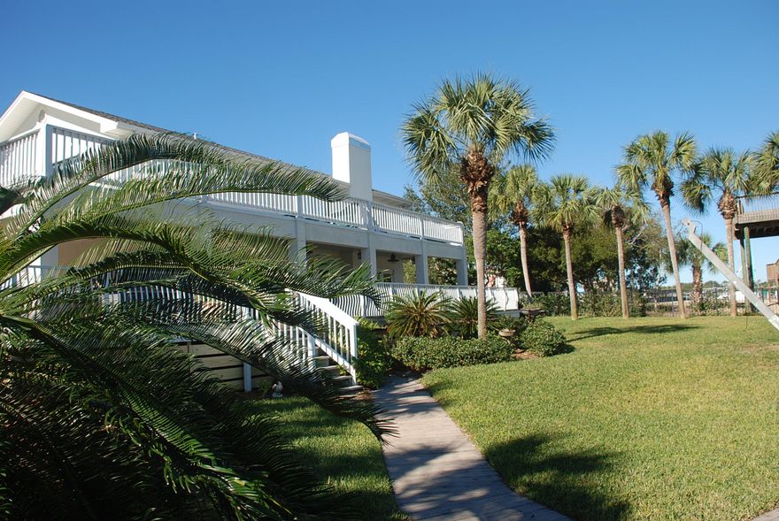 The most desired location on Holiday Isle. Spectacular balconies to allow watching of dolphin frolicking, winter sunning on the upper south deck, or outdoor dining. Remodeled immaculate 5 bedroom beach house only steps to deeded beach access. Perfect for entertaining, family vacations, or quiet nights on the water. Master located on first level with fabulous harbor views so one can enjoy coffee in bed and or a beautiful sunrise. This is an incredible house and location. MUST SEE!!!!!!! NEW HOT WATER HEATER AND TWO NEW HVAC UNITS.