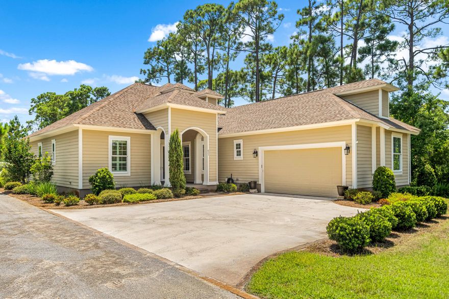 New price below appraisal! This beautiful home sits on half an acre of land. The backyard has plenty of room for a pool to keep you cool during the summer heat! A huge 14 x 37 back deck, part of it being screened in with a TV already installed. Inside you will walk in to find a large open concept living and kitchen area with 10'4' ceilings, decorative archways, solid wood cabinets, granite counter tops, hurricane windows and doors, travertine and wood laminate floors. The Master suite has its own side of the house with plenty of room and access to the back porch. The master bath has a jacuzzi tub, his & her sinks, walk-in marble shower. The other two bedrooms are located on the opposite side of the house and share a bath. The two car garage provides plenty of storage.