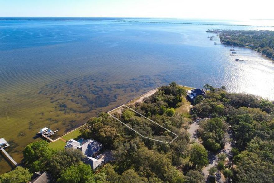 Fantastic opportunity to build your dream home in one of the most exclusive waterfront communities in the Destin area, the gated Estates at Indian Pointe. Enjoy private luxury in this elite community of bay and bayou homesites, with 101 waterfront feet you can enjoy stunning views and direct boat access to Choctawhatchee Bay. Bayside Tranquility at it's finest, with the potential to design and create your perfect home, pool and private dock, you can make the most of the alfresco lifestyle on your terms - while still enjoying Destin's superb amenities including shopping, dining, seasonal entertainment and the world's most beautiful beaches. Please also see the ''to be built'' plans on MLS 799647.