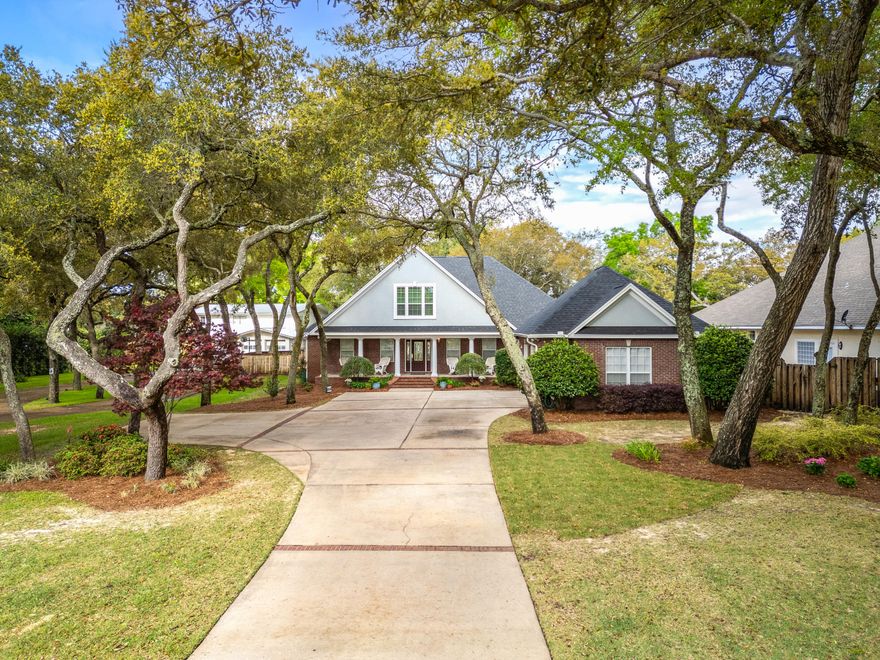 Welcome Home! Classic architecture and comfortable elegance is what you'll find nestled under old growth oaks, perched on a high/dry 1/2 acre homesite, overlooking quiet Cobbs Bayou. The long landscaped drive leads you to the welcoming wide-gabled front porch. Once inside, the foyer leads your eye all the way through to the beautiful backyard & bayou views. Comfortable floor plan, offering space for just about anything, whether it's entertaining the crowd or quiet family time. 1st floor primary suite offers a spa-like bath, private water views & french door to the back porch. 1st floor includes living, family & dining rooms and a private guest suite with its own bath. An amazing kitchen is the hub of the home with a huge granite island, gorgeous cabinetry and b'fast area. . . .