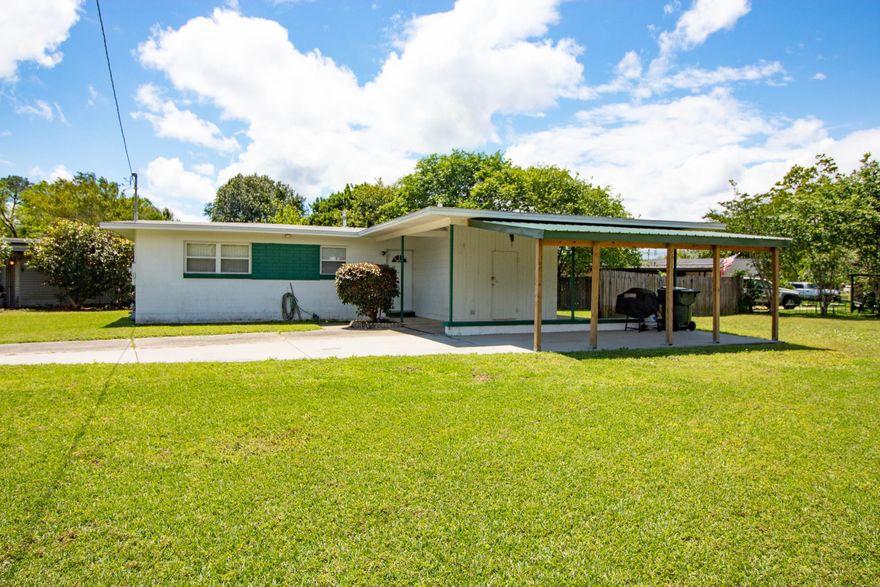 Adorable, immaculate 3 bedroom, 1 bath house with a HUGE corner lot. Rooms are bright with multiple windows. Each room has a ceiling fan to making house comfortable and inexpensive to cool. Roof, windows, HVAC new in 2005. Paint, carpet, commode, refrigerator, gas stove and additional carport all NEW in last two years. Whether its a primary home or an investment property, this home is move in ready!