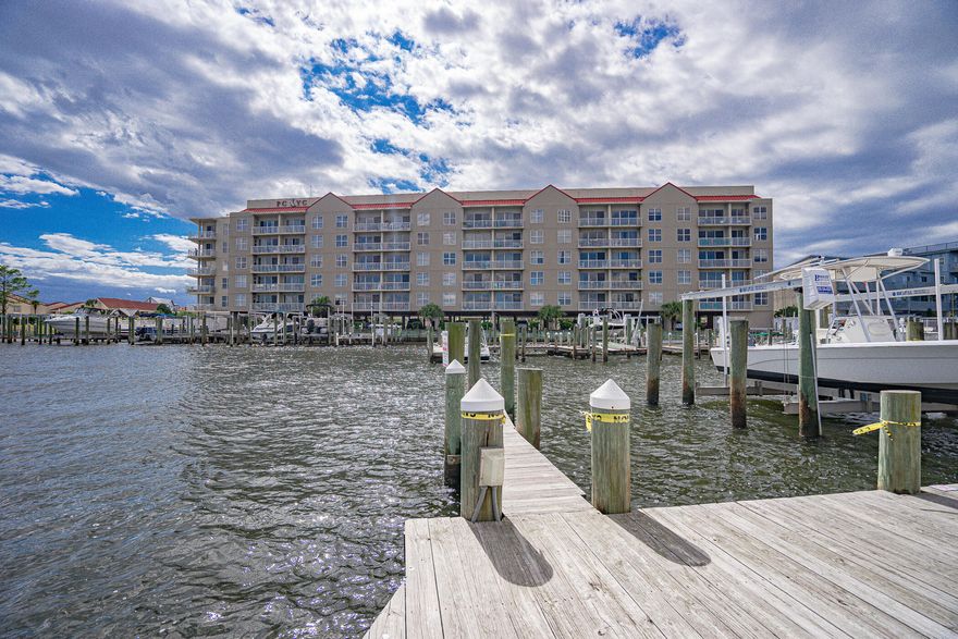 Enjoy life on the Intracoastal waterway in a gated community with this spacious 1,845 sq ft 2 bedroom 2 bath condo and deeded 25 ft. boat slip.Sweeping views of the Santa Rosa Sound and boardwalk access to the Gulf. Unit features unusually spacious rooms and great storage. Condo includes upgraded baseboards, crown molding, textured ceilings, Hunter high end fans, solid-core doors, bathroom fixtures, lighting, and Kohler toilets throughout. Wet bar added in 2015.Kitchen has island with additional storage and pantry pullout shelves, stainless steel appliances, and eating bar. Oversized master bedroom suite has private bathroom, double hallway closets, walk-in closet with built in drawers,hanging space, laundry room w/washer/dryer/storage. Sizable additional bedroom has an en suite bathroom. Community amenities include heated spa/pool and barbecue grill. Buyer to verify all measurements