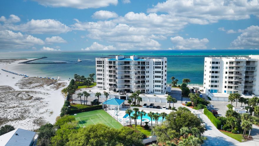 What's Special? Breathtaking Views of the Destin Pass, Destin Harbor and the Gulf. Two Adjacent Private Garages with a Climate-Controlled Storage Unit. A Boat Slip Designed for a Large Vessel. Two Expansive Balconies, One Featuring a Built-in Natural Gas Grill. Experience The Ultimate condominium lifestyle in this stunning, fully furnished west-end unit, showcasing three spacious bedrooms, three full baths and a versatile bonus room that can serve as a private office or bunk room. With 2,630 square feet of waterfront living, you'll be captivated by the tropical views from every room ensuring you'll never miss a sunset.  This expansive condo offers ample space for entertaining, including two living rooms with floor-to-ceiling windows. For your privacy and peaceful enjoyment,The Ultimate is non-rental. Security fenced and gated, the lobby and private elevators are likewise equipped with controlled access.

The kitchen is beautifully appointed with solid surface countertops, a custom-tiled white backsplash, a vast wrap-around bar with recessed lighting and elegant white raised cabinetry with a large built-in wall pantry.

The centrally located dining area includes a wet bar with a wine cooler and a unique entertainment divider accented with Moroccan-inspired tile, enhancing the coastal ambiance. Light wood plank flooring flows through most of the condo, while the kitchen and baths feature tiled floors. Each of the two large guest bedrooms have their own full baths, a cozy sitting area and stunning views. The master bath is designed with double vanities, a step-up whirlpool garden tub with magnificent views, a separate shower, a private powder room, a spacious walk-in closet and a conveniently located laundry room.

Additional interior highlights include authentic wooden plantation shutters and custom drapes. This condo offers a peaceful coastal haven with luxury amenities: a fully-equipped workout room, business meeting room, tennis court, Olympic-sized pool with lap lanes and a hot tub, deeded beach access and a security-gated marina.
Don't miss the opportunity to own this exceptional pet-friendly property, convenient to dining, shopping, art galleries and world-class golf. Please note: There is an annual marina fee in the amount of $2,517. 
