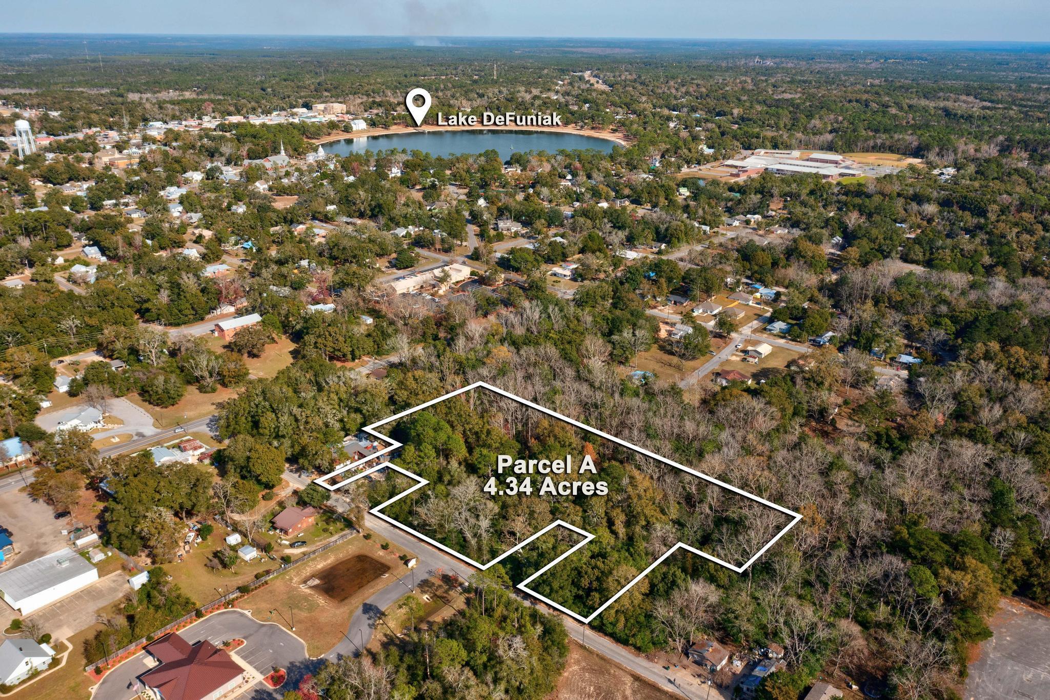 This 4.34-acre wooded land is located right off Interstate 10 exit in the heart of Defuniak Springs. With its prime location within a mile of Walmart and Defuniak Lake, this fast-developing area offers immense potential. Whether you're looking to build your dream home, develop a subdivision, start a business, or build apartments, this lot is perfect for your plans. Additionally, it has the potential to be zoned for commercial use, adding even more value to this incredible opportunity. Don't miss out on this prime chance to bring your vision to life in a highly convenient location!