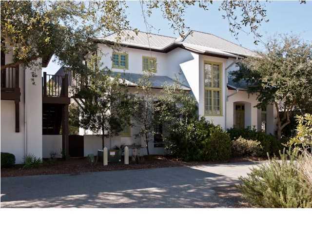 Situated on one of Rosemary Beachs largest lots, this East Kingston Lane compound with four bedrooms/four and a half baths, first and a one-bedroom carriage house, is the quintessential family beach retreat with a two-car garage and a additional two-vehicle parking pad. White stucco with pops of Chartreuse green trim, give this house fresh curb appeal with an updated twist. The kitchen showcases a custom mosaic tile back-splash, top of the line appliances and granite counter-tops, opening up to the spacious and light filled great room with dining and living area. Gorgeous heart pine floors are found throughout the home and punctuate the attention to custom finishes. Modern fixtures throughout the home are both smart and aesthetically impressive. When living in Rosemary Beach, outdoor livin