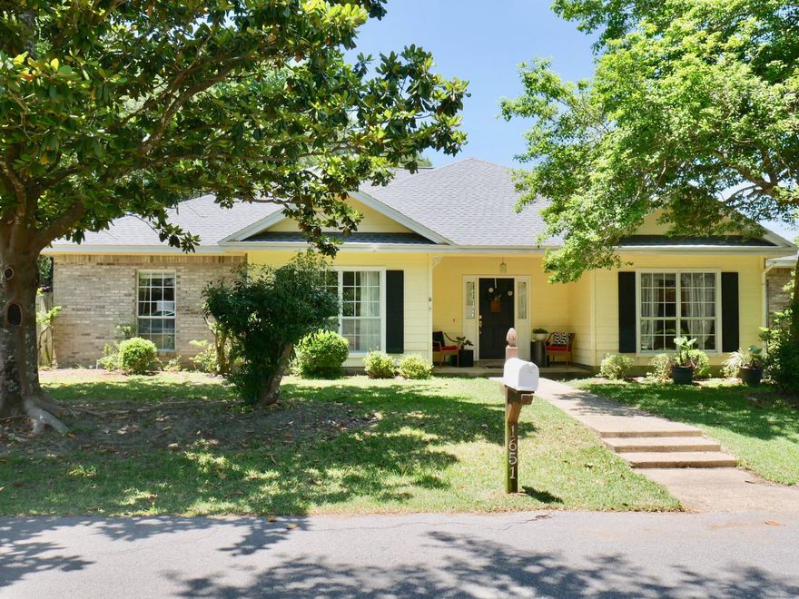 This updated and beautifully maintained Parkwood Estates home with a NEW ROOF is just what you have been waiting for!! Located on a .43 acre lot on the corner of a private cul-de-sac, there is plenty of room for the kids to play and for extra parking if you need it. When you enter the home through the bright foyer, you will find yourself in a spacious great room featuring a cathedral ceiling, an attractive corner wood-burning fireplace, and plenty of room for your large, comfortable furniture. Currently used as a playroom, the dining room could also be utilized as an office. The kitchen off of the dining room offers granite counters, refinished cabinetry, and stainless appliances. It is open to the oversized breakfast room with plenty of space to share casual meals with family and friends plus a convenient computer desk. The master suite is oversized and features a master bath with a walk in shower and soaking tub. There are two additional bedrooms as well as another full bath to complete this home. Along the back of the home is a 40' long deck accessible from the master bedroom or from the great room (the hot tub has not been used in years and conveys as is). Shaded by mature trees and shrubs, you'll love the large fenced backyard. Roof (2022), Water Heater (2019), compressor (2015)