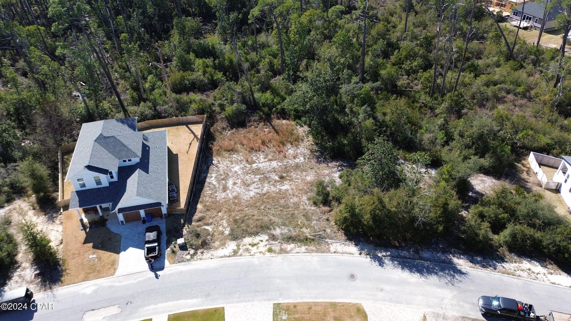 Welcome to Sanctuary Beach, a gated community on Panama City Beach. This is a nice lot in a much sought after community, minutes from golfing, boating, Pier Park and of course the beaches! community features a swimming pool, very quiet and quaint, perfect for a family or just your dream home. call today to view this wonderful lot and build your home!