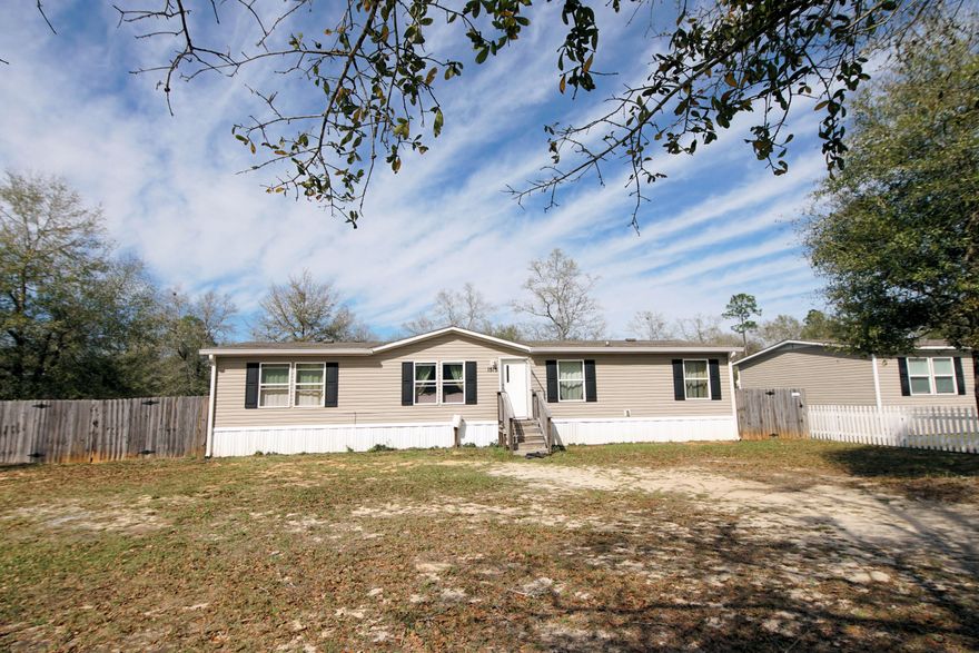 Cozy home with a super nice lot and tons of space. Privacy fenced back yard with a spacious deck and additional uncleared land behind fence. The home features an open floor plan with large dining area suitable for entertaining. Home is being sold with all furniture included. Come check this one out!