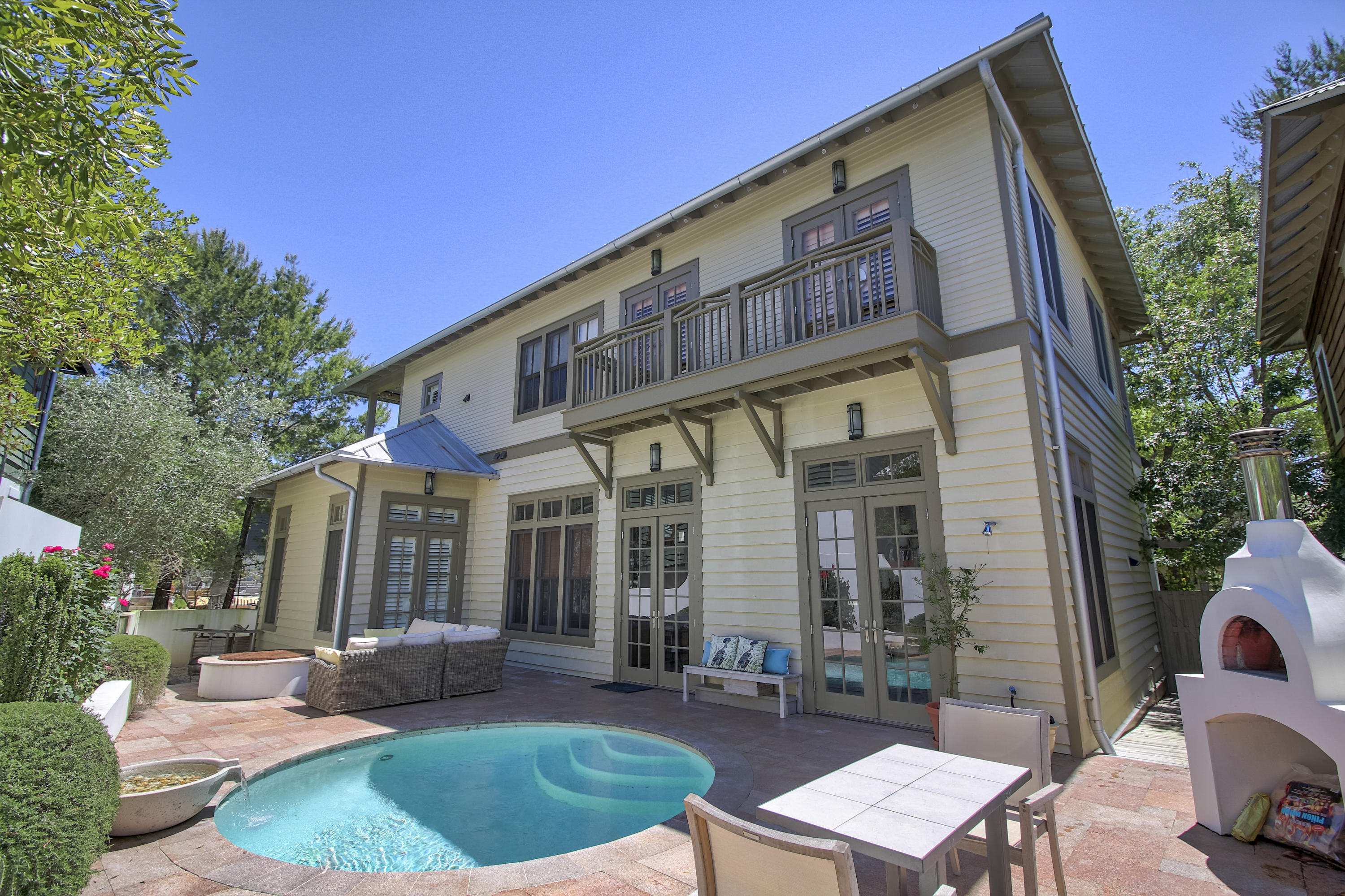 THIS IS THE ULTIMATE BEACH RETREAT! Perfect for entertaining this home was designed with an open floor plan that flows out to the courtyard offering a heated pool, summer kitchen, fire pit, all brick pizza oven and a zen garden. All so you can enjoy outdoor living at it's finest.The first floor of the home includes the living, dining, kitchen and the master bedroom. The second floor boasts three guest bedrooms each with their own private bath. There is a gathering area and media room for the family to enjoy as well. Wrap around porches on both the first and second floor will invite you to relax and enjoy the tranquility of this wonderful boardwalk location.The double car garage and carriage house adds even more to this wonderful home. You need to come and see this home for yourself.