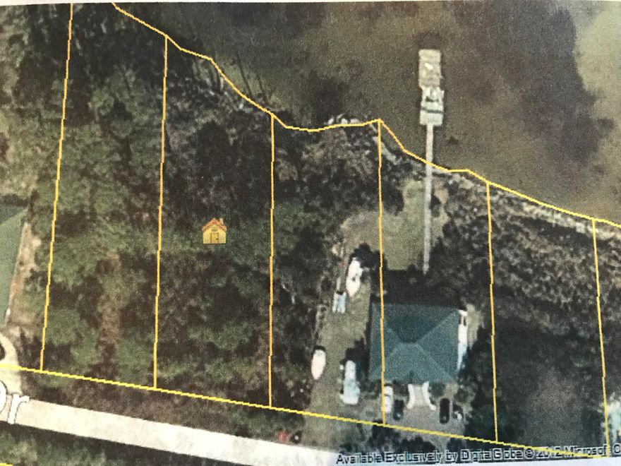 Build your dream home on the bay. This gorgeous bay front home site has no HOA, no restrictions! THis hidden gem of a neighborhood is located behind the Silver Sands Outlet mall, close to shopping, reestaruants and the most beautiful beaches on the Gulf Coast! Make this your piece of paradise!  Make an offer today! Buyer to verify all imformation they deem important. Survey and wetlands study available.