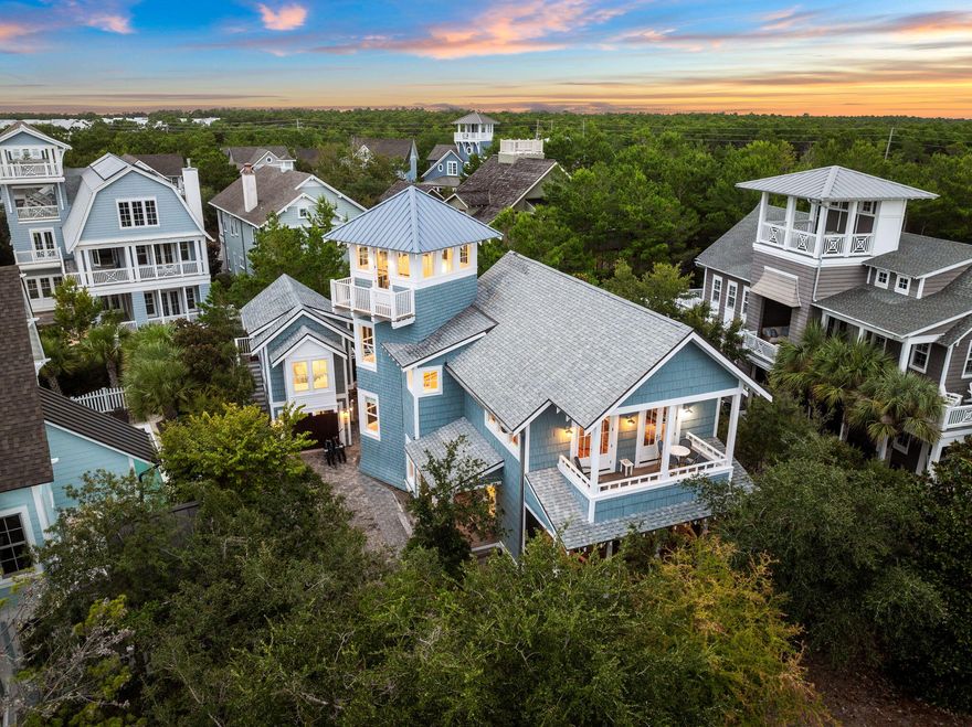 Located in the highly sought-after gated community of Watersound Beach, in the exclusive Bridges section, this 4 bedroom 4 1/2 bath home is just a short stroll from the private deeded beach.There are 3 spacious bedrooms in the main house, each with en-suite bathrooms and two living areas. Designed with an open-concept layout, the expansive kitchen, living, and dining areas create a seamless flow. Outdoor living abounds with porches both upstairs and down along with a charming outdoor dining area between the house and carriage. The views from the third floor tower provide a glorious view of the community and glimpse of the gulf and lake. The carriage house above the garage features an additional bedroom, bathroom and kitchenette, offering flexibility for guests or extended family. With Camp Creek Lake, the nearby community pool, clubhouse, and all the luxurious amenities Watersound Beach has to offer, this home is not to be missed.