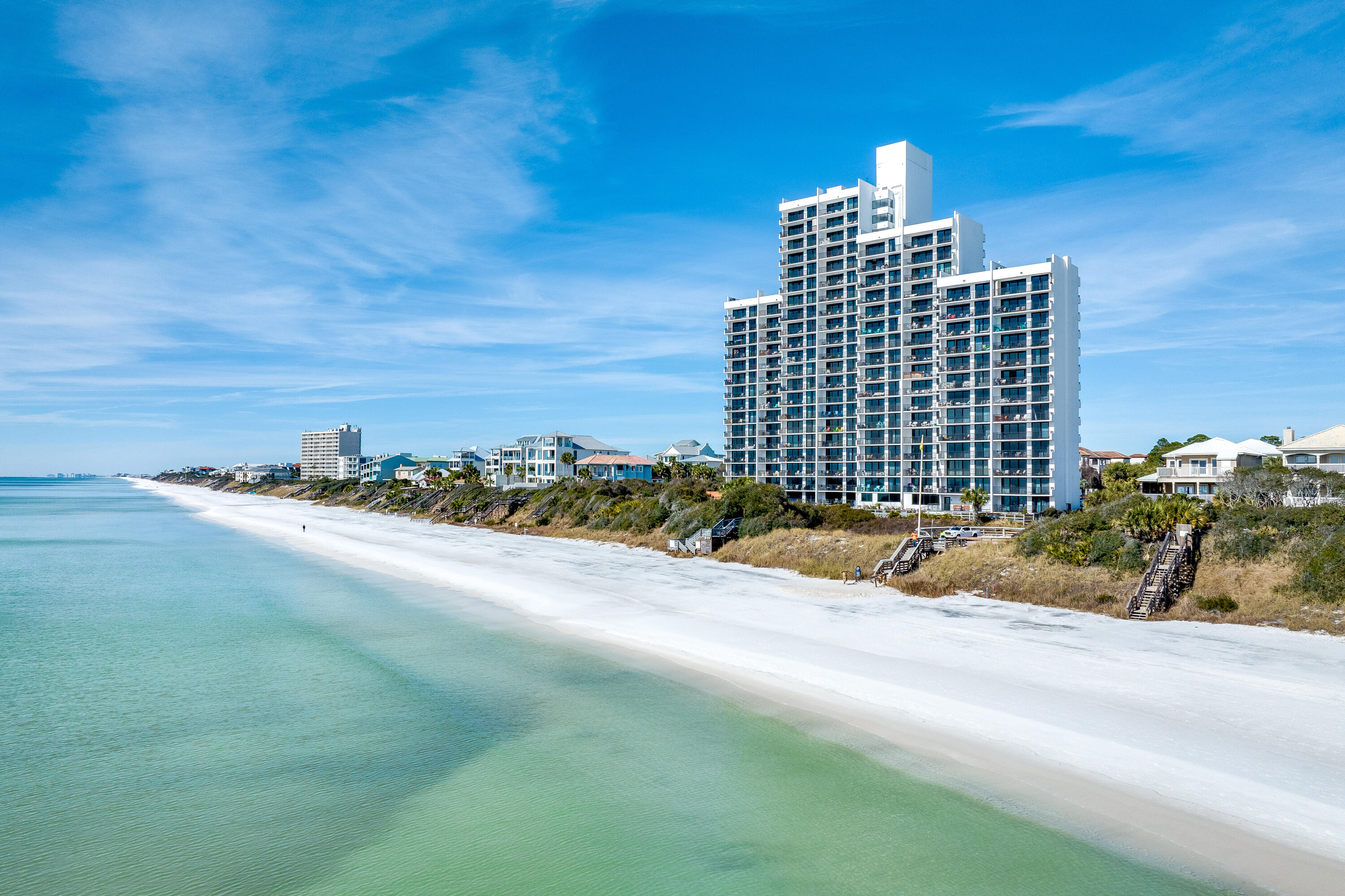 Beautifully modernized and updated inside and out, this luxury two-bed, two-bath condo is on the fifth floor at the landmark One Seagrove Place. The entire exterior of the building and the amenities have all been remodeled, giving the entire condo a fresh new look. This unit has a newly updated kitchen and bathrooms making it a very attractive entry-level condo in the popular 30A market. New LVP flooring adds sleek sophistication to the entire unit. The entrance hall leads into an open floor plan with a well-planned kitchen boasting stainless appliances, sleek glass tile splashbacks and beautiful new granite countertops. Shiplap adds accent detail to the breakfast bar which seats several diners. There's an additional dining area for more leisurely meals. Move into the light and spacious sitting room and enjoy stunning gulf views through sliding glass doors. The balcony has ample space for alfresco dining and relaxing while drinking in the panoramic coastal views. Bedrooms include a gulf-view master suite with balcony access and there's a spacious second bedroom. Both bathrooms have undergone a facelift with new tile and new glass shower doors. Owners can look forward to enjoying a relaxing Florida lifestyle with access to the new fitness center, community pool and seasonal beach chair service. It's the perfect family vacation home that's sure to appeal to investors looking for steady year-round income. Enviably located between Seaside, Florida, and Rosemary Beach, residents and guests are spoiled for choice with boutique shops, restaurants and live entertainment in both communities.
