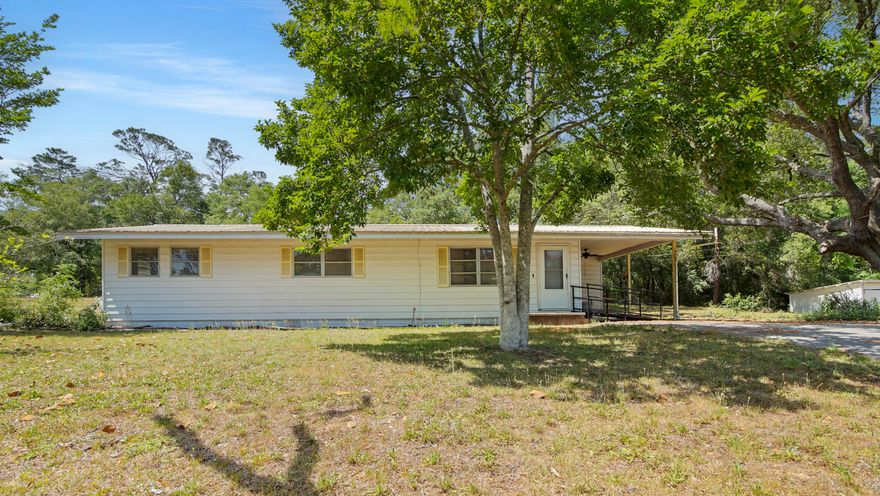 This clean, comfortable, and affordably priced 3 bed/1 bath home sits on 1 full acre made up of three platted lots, giving you extra space and options to even build or sell. This home has gotten some solid upgrades lately, including new wiring, newer HVAC (2019), and a new walk-in shower. You'll find fresh interior paint and easy-care vinyl plank flooring throughout. The office could easily be made a 4th bedroom.There's a metal roof, attached carport and the yard is wide open with room for a garden, workshop or even future construction. Since the home is centered on the middle lot, the two on either side could be sold or built on separately. It's conveniently located in Mossyhead, approximately 2 miles from I-10 ,between DeFuniak Springs and Crestview, and just north of Niceville.