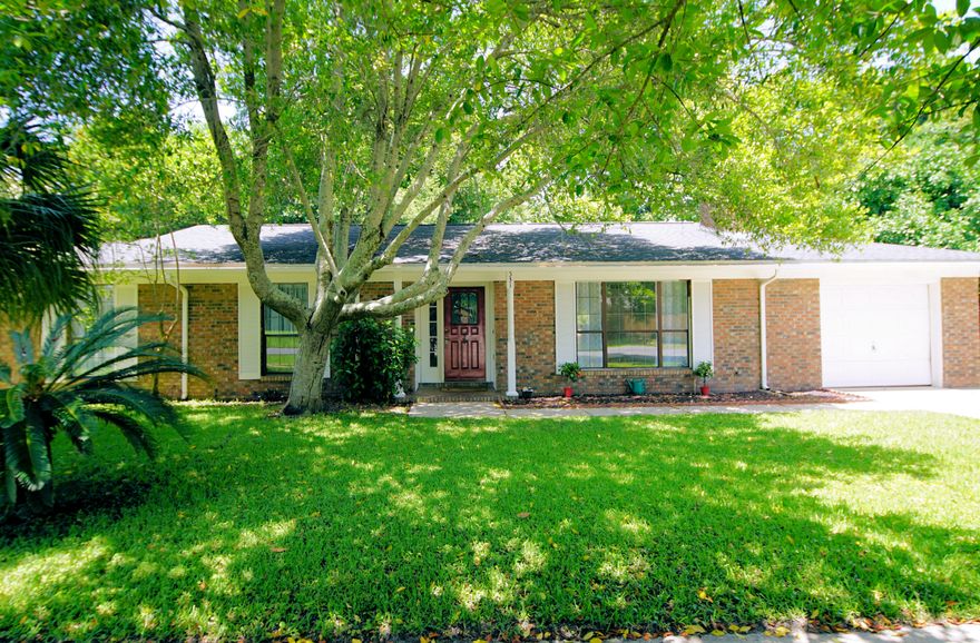 West Destin gem! All brick 3 bedroom 2 bath home located on over 1/4 acre lot. Minutes from the Gulf of Mexico, Joe's Bayou boat launch, shopping, and world class restaurants. Walk to Destin Elementary. Plenty of room for a boat trailer alongside a bountiful grapefruit tree. Enjoy cookouts and the Beach lifestyle with with a lush green lawn and large backyard deck and privacy fence. Large 14'X12' bonus room with sliding glass door to deck located off master may be used as an office, bedroom, or studio. Another bonus...garage has been converted to an 8'x13' storage area and a heated and cooled 20' X 13' flex room and laundry area. Beautiful views of backyard from open dining/ kitchen area. Living room features a cozy fireplace and is open to dining area. Copper wiring and Flood Zone X.