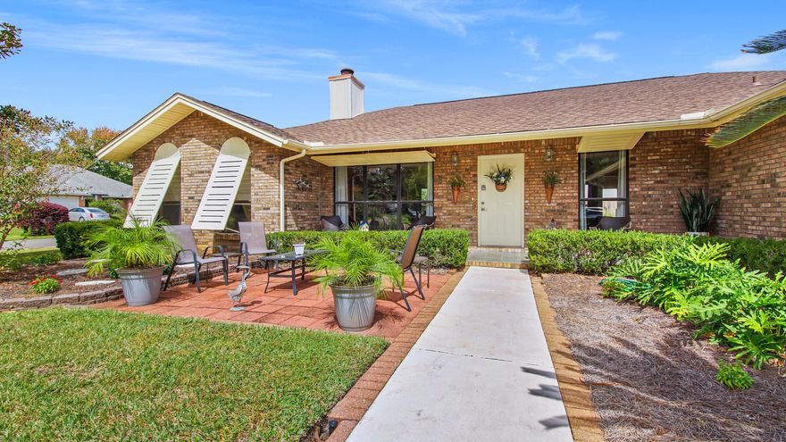Beautiful home located on corner lot, great curb appeal, in Kell-Aire Gardens in Destin.  As you enter this 3 bd 3 full bath home, you will notice the charming open living/dining room area with wood fireplace, vaulted ceilings, large open windows for plenty of natural light.  Spacious kitchen with marble counter tops with bar for extra seating.  Built in coffee bar.  Custom oak cabinets throughout home in kitchen and all bathrooms.  Split-bedroom floor plan with spacious bedrooms and the guest bedrooms have bamboo flooring.  Large Florida room is heated and cooled for your entertaining pleasure.  Great front and back patio seating areas, minutes to beach, Brick exterior with Bahama storm shutters,   Parking will accommodate a boat, RV or other activity vehicles.   Home sits across from the