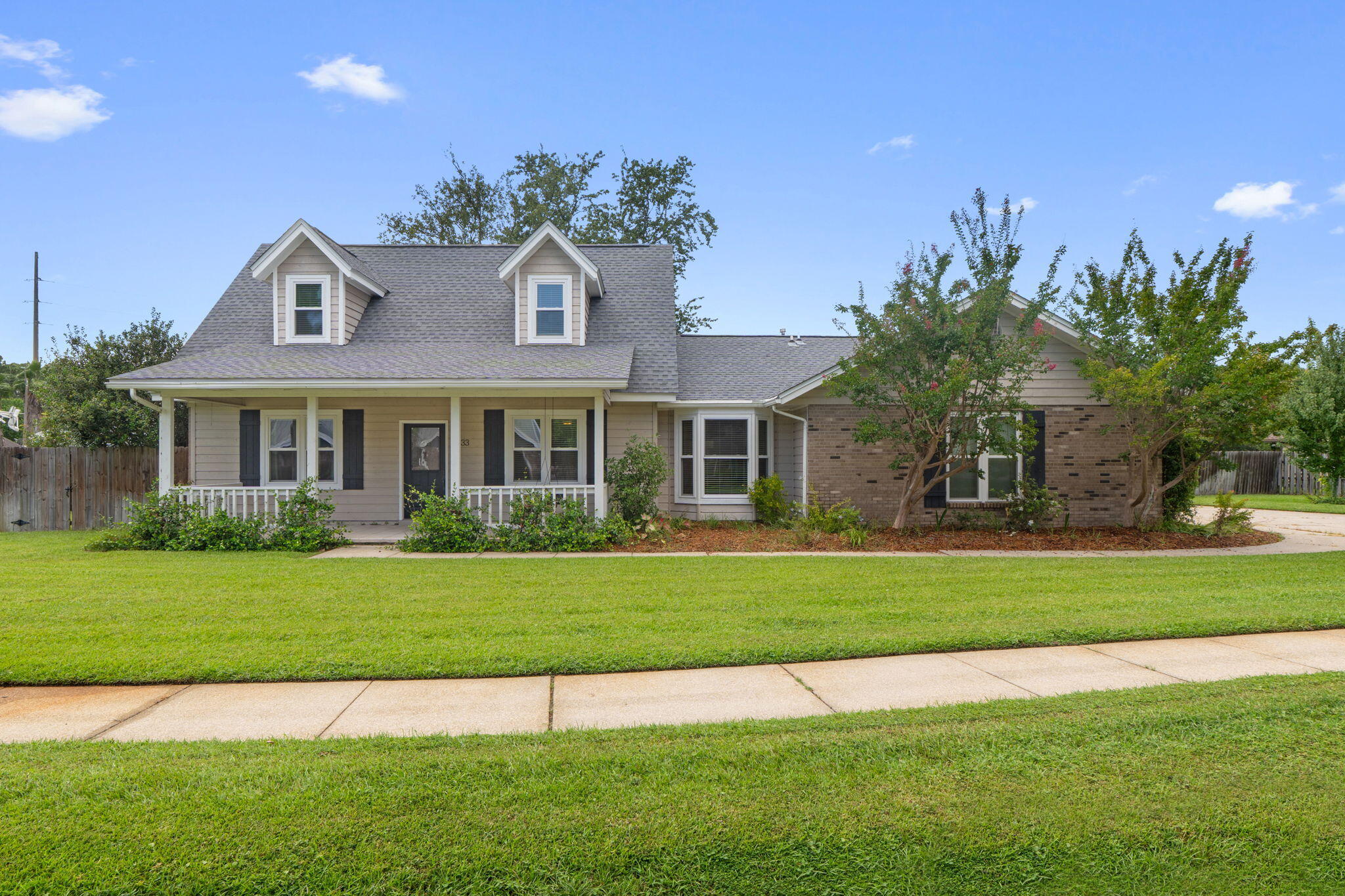 Perfectly located between Eglin AFB and Hurlburt Field, this home offers the ideal balance of convenience and comfort. Grocery stores, shopping, and restaurants are all just minutes away.Inside, you'll find a thoughtful floor plan with the primary bedroom located downstairs and two additional bedrooms upstairs. The upstairs bathroom has been beautifully updated, and the home itself features many recent improvements. Hurricane-rated windows, a newer roof, fresh carpeting, and fresh paint throughout most of the home give it a modern and well-maintained feel. Other updates include a new water heater, HVAC system, sprinkler pump, and even an EV charger installed in the garage. The large backyard is a standout feature, offering both privacy and charm with new fencing, raised garden beds filled with organic soil, perennial landscaping, and two rainwater catch systems.
Located in a neighborhood with friendly neighbors, this home has only had two owners in its lifetime, a reflection of the care and pride of ownership it has enjoyed. With its prime location close to both Air Force bases, its numerous updates, and its inviting outdoor space, 33 Tanglewood Circle is ready to welcome its next chapter.