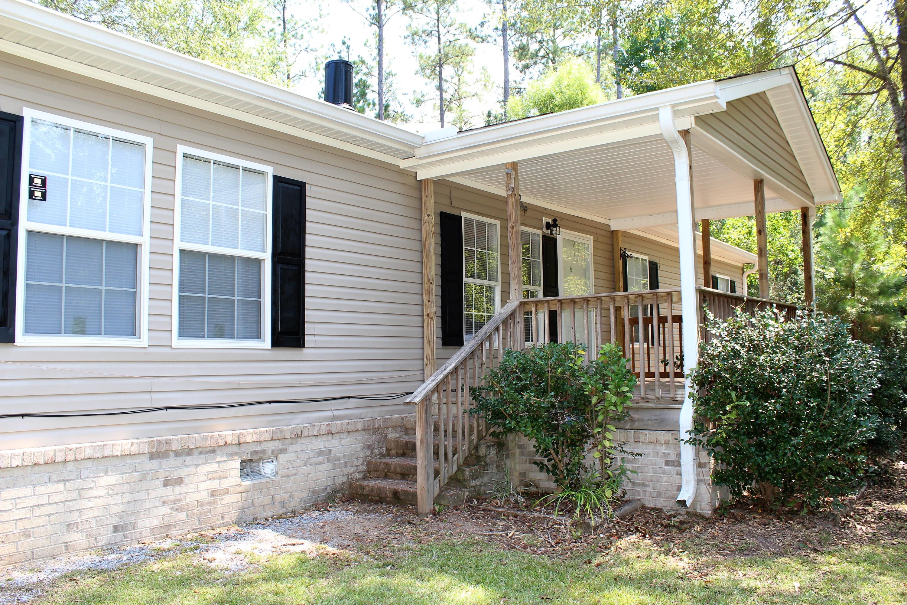 Beautiful inside and out. Every room in this home is something special. The kitchen has loads of counter and cabinet space with stainless steel appliances and a center island. The living room has a wood burning stone fireplace. The master suite has a private bath with garden tub, separate shower, and double sinks. The 3 bedrooms on the other side of the home share a full bathroom with an attached laundry room. Outside you will find plenty of space on the 29' deck to relax in the quiet country setting or host a cookout. *All measurements approximate.