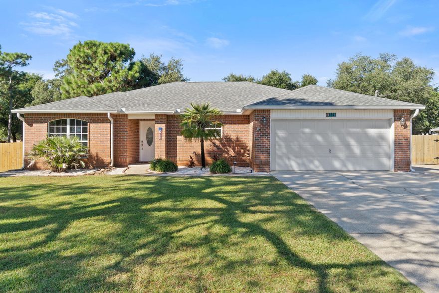Welcome to this well-maintained, brick home in Holley By The Sea! This spacious property features 3 bedrooms, 2 full bathrooms & a bonus room. Situated on a 0.45 acre lot with a fully fenced backyard, a large yard building equipped with electricity & heating and air, & a carport in the backyard -  perfect for parking your RV or boat. You'll find tons of updates throughout the home, including a beautifully updated kitchen with new countertops & backsplash, painted cabinets, & new stainless steel refrigerator & microwave! 2022 HVAC and 2022 Gas Water Heater! New LVP flooring was installed throughout the living room & additional bedrooms! Outside you'll find, a new fire pit, and the updated yard building with new vinyl flooring, new interior and exterior paint, & a 2021 A/C unit!