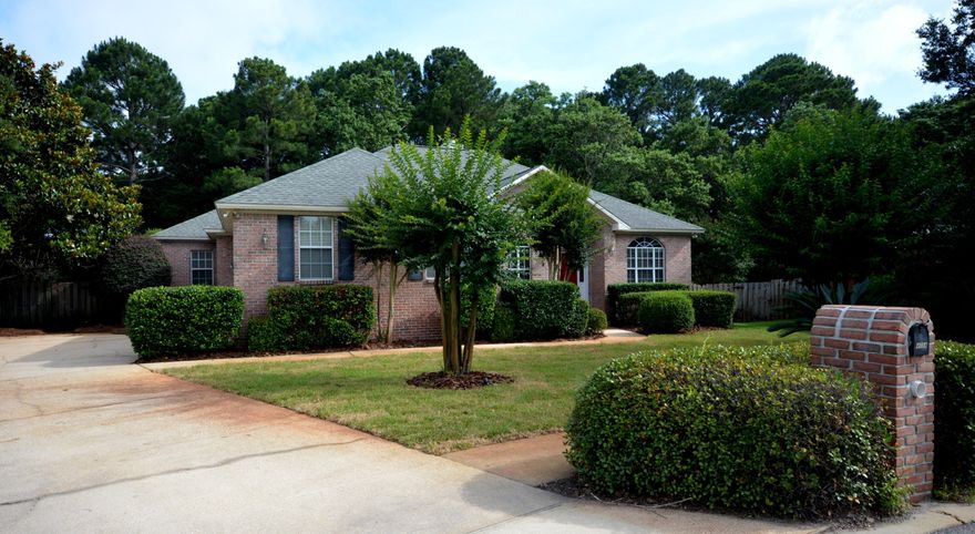 Create memories in this beautiful Destin Home. The immaculately landscaped yard and attractive design will immediately capture your attention as you enter the quiet culdesac where this home is located. Imagine the possibilities for entertaining, relaxing, grilling-out, or reading a book from the screened in lanai, oversized deck, or the the LARGE back yard that backs up to a nature preserve. There are no neighbors to worry about and plenty of room for a pool. The interior details are equally impressive. Upon entering, you will notice REAL hardwood floors in all main living areas including the master bedroom while the bathrooms have 18'' tile. All ceilings are 10 ft. with crown moldings throughout. The kitchen is a chef's dream with custom cabinets and granite countertops. Built-in's are