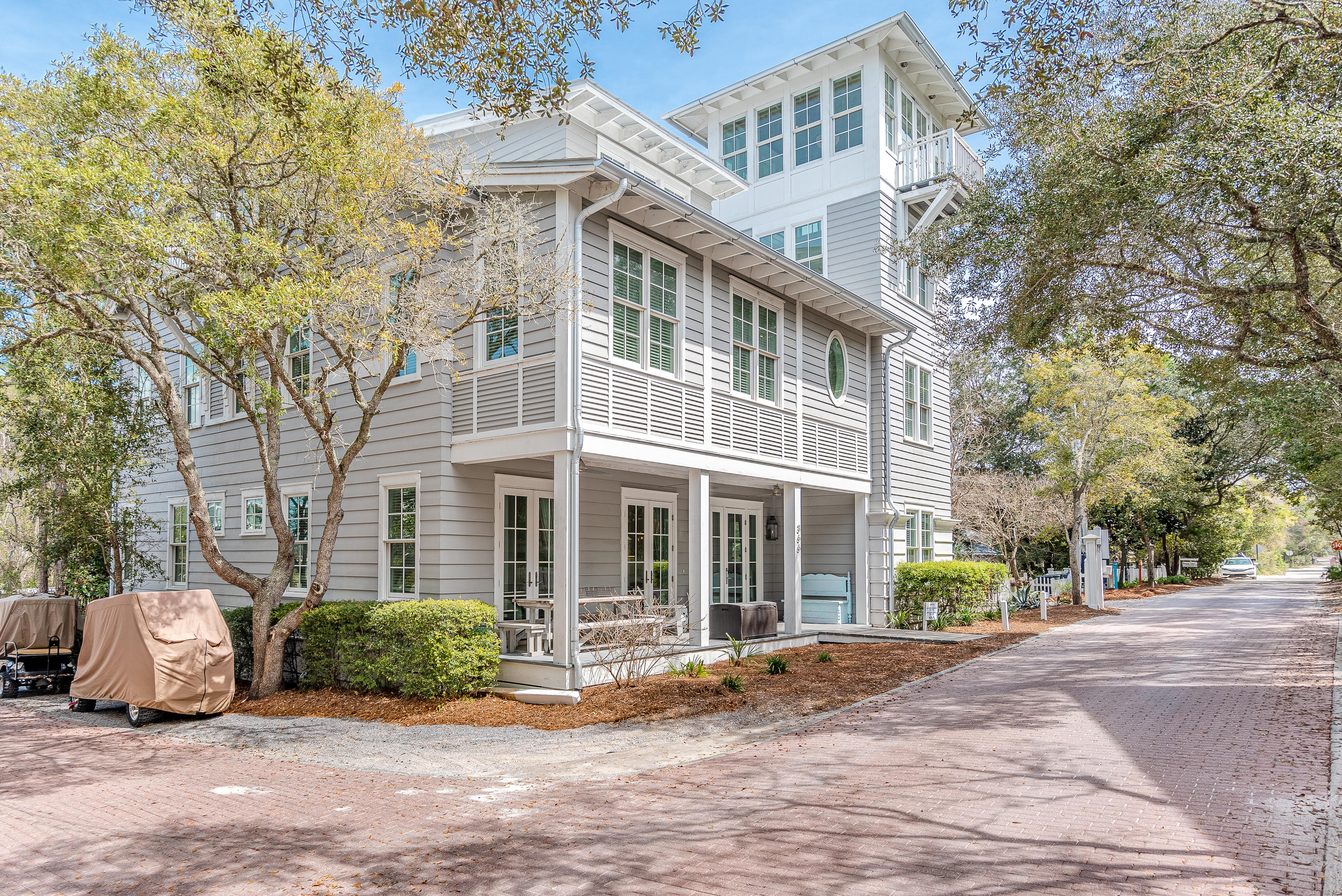 'HAPPY OUR!'  Got a big family who loves the beach? Well here's your golden opportunity to own one of the few homes in SEASIDE large enough to accommodate everyone! This is the beach home that will stay in the family for generations to come. Being located near the recreational area provides a more peaceful atmosphere, yet  just a stones throw away are two heated pools, fitness center, tennis courts, croquet lawn, playground and more. Head the opposite direction and it's a quick stroll to the beach through the iconic Tupelo Pavilion.The front porch, softly lit by gas lamps, beckons a very Southern sit-down & stay-awhile approach.  Upon entering the home, you're greeted with a delightful open floor plan so popular at the beach. Three sets of French doors and