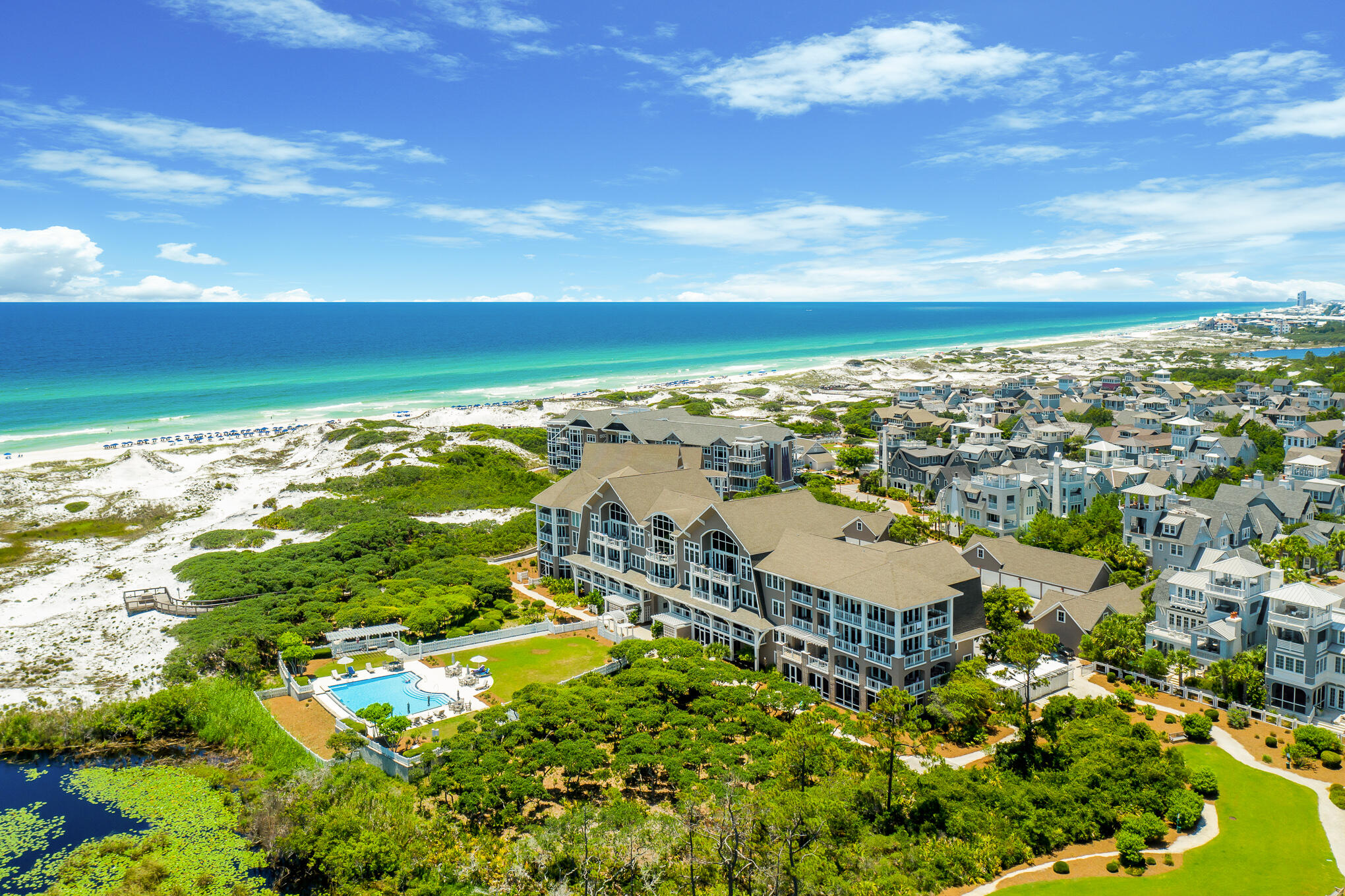 Designed by the acclaimed Graham Gund Architects, Compass Point II emulates the coastal Nantucket architecture found throughout Watersound Beach. With only twenty-five residence style units, the low-density complex is strategically positioned behind the crystalline white sandy beaches and established dune vegetation offering short views of the local habitat and long views out to the sea. The desirable B1 floor plan spans two levels with nearly 2,300 square feet of thoughtfully planned living space in addition to an attached one-car garage. Unit 108 boasts a first-floor main suite with a spacious bath and direct access to the screened porch and beach boardwalk. An office nook, laundry area, and bunk room adorned with shiplap accents and antique shutters complete the first floor The open living and dining area on the second floor was configured with entertaining in mind with passage to the deep shady porch synonymous with tranquility and relaxation. The kitchen features a luxury appliance suite, ample storage, and a breakfast bar perfect for serving guests while overlooking the stunning views. Two additional bedrooms with ensuites are also found on the upper level. The unit was just completely remodeled and professionally furnished creating a truly turn-key opportunity.

Watersound Beach resides on 1,400 acres and over a mile of private white sugar sand beaches. The culmination of amenities and exclusiveness affords residents with the epitome of private coastal living while remaining geographically poised near the world-class dining and entertainment venues 30A has to offer. Notable amenities include a heated community swimming pool, fitness center, pedestrian bridges and footpaths to the beach, and multiple community parks.