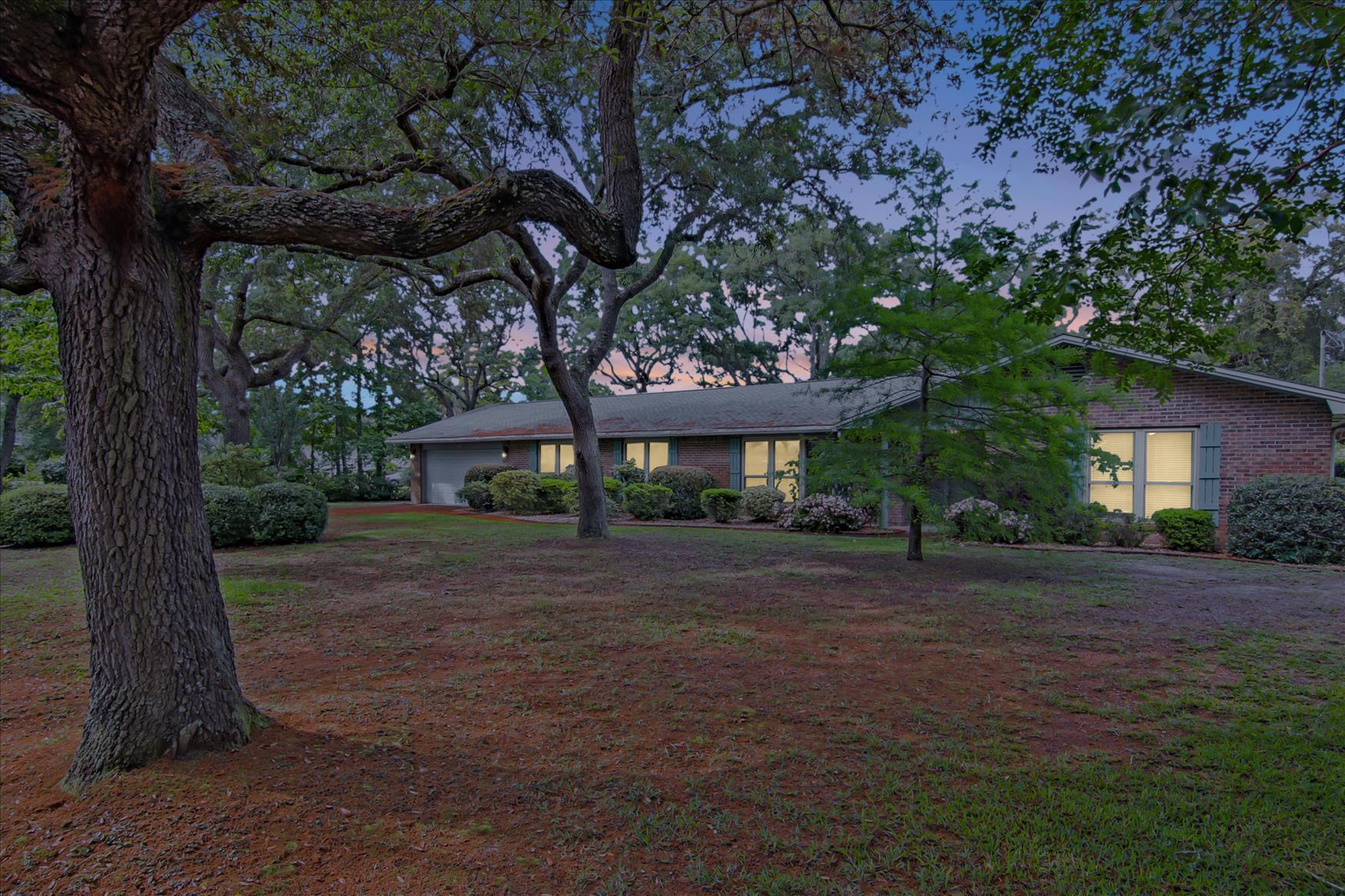 Expansive brick ranch home featuring 4 bedrooms, 3 full baths on a beautiful lot in Lake Lorraine, Shalimar. The split floor plan features real hardwood floors, 3 bedrooms plus bath including master to the right and spacious MIL bedroom with full bath past the family room and kitchen. Large kitchen features abundant wood cabinets for ample storage, newer double oven and dishwasher. Patio through french doors to large back yard. Formal living room and formal dining as you enter the home. NEW ROOF FALL 2021, Extra large 2 car garage, dual sink vanities in all 3 bedrooms. MUST SEE!!!