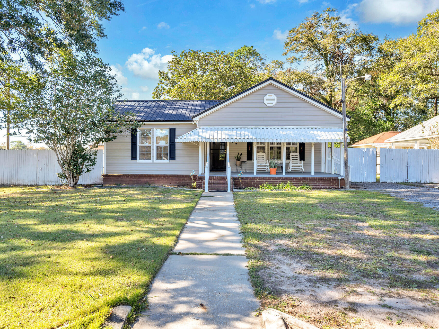 This home has so many extras! White picket fence, remote-operated gate, insulated workshop with roll-up door, power and air conditioning, new above-ground pool, firepit, tankless water heater, the list goes on! This 2/2 has been updated to include new cabinetry in the kitchen, tile backsplash, stainless steel appliances, spa tub in master and more. The guest room has copious closet space and a built in murphy bed that conveniently stores away, allowing for extra room when needed. The entrance is inviting with a spacious front porch overlooking the large lot, wrapped in a picturesque white-picket fence. Ample parking is available at your front door or park your car securely behind the remote-operated gate on the side yard. The backyard is perfect for entertaining with a firepit area adorned with string lights. Large oaks and the tall back fence provide privacy and a feeling of seclusion although you are right in the middle of town! Down the street is Richbourg School, Northwood Elementary and a food truck station for the nights you don't feel like cooking! This one will not disappoint!