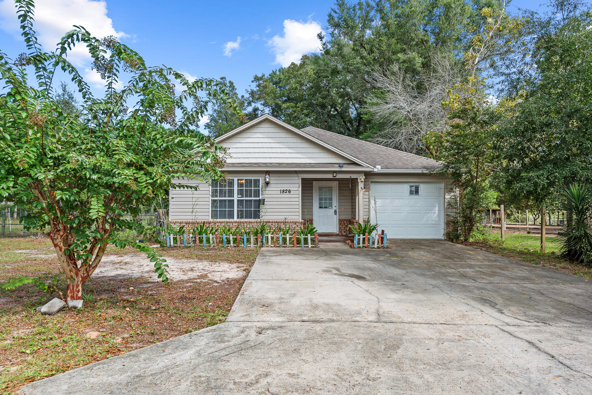 Take a look at this cute, affordable home on a double lot, just minutes from Crestview and a short drive to Eglin AFB / Duke Field.  The home has tile in all living spaces w/ carpet in the bedrooms. The living room has a 10' ceiling and there are french doors leading out to the porch & backyard. The home sits on a peaceful double .32 acre lot that is just over a mile from Antioch Rd.HVAC System 2020, Water Heater 2008,Roof 2008