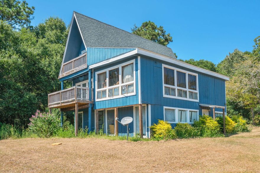 Nestled in the peaceful countryside, this 3-story cabin sits on 1.23 acres and offers the perfect opportunity for anyone looking to invest in a project with potential. Featuring 4 bedrooms and 2.5 baths, the home has seen some updates but is ideal for a buyer eager to add their own personal touch. The second and third floors house spacious bedrooms with beautiful views of the surrounding land, making it a perfect retreat for those seeking quiet living and room to grow. Whether you're looking for a weekend getaway or a full-time residence, this property is a rare chance to create something truly special.Roof - 2022Hot Water heater- 2016Septic Tank pumped- 2022