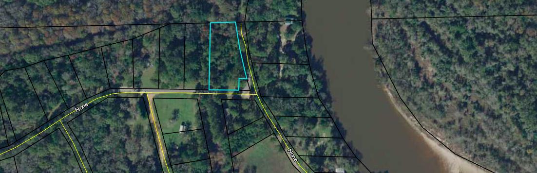 Over 3/4 acres, in Westville. This would make a great retreat property. Located across the street from the river. Seller is motivated.