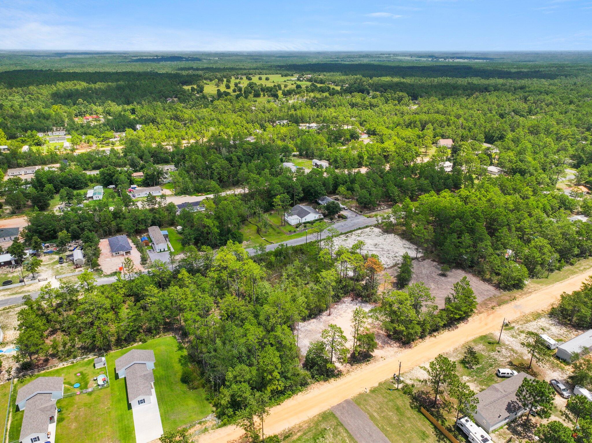Exceptional Opportunity: Two Land Parcels with Buildable Potential! Discover one of the last remaining gems in this coveted area! We are exclusively listing Lots 28-29, located as the two parcels on the left when facing the property from Laurel Lane. This offering provides a unique opportunity to create your dream home, vacation retreat, or even place a mobile home. Lot 28: Wooded with serene stream. Potentially buildable if buyer brings in additional fill dirt to elevate the property. Lot 29: Buildable with a completed percolation test and fill dirt added. Partially cleared with space for driveway. Enjoy the most beautiful beaches on the Emerald Coast, with convenient access to Highways 331 and 10. This location is ideal for both tranquility and accessibility. More... Prime Location and Features:
Two Parcels:
Lot 28: Wooded with a serene stream; potentially buildable if additional fill dirt is added.
Lot 29: Buildable; percolation test completed, fill dirt added, and partially cleared with driveway access prepared.
Convenient Access: Located with ease of travel to Crestview and Defuniak Springs via Highways/331 and/10.
Utilities Ready: Electric and water available at the street, with land prepared for septic on both lots.
Driveway Access:
Lot 29: Driveway has been cut in.
Lot 28: Prepped for driveway access with trees cleared.
Septic and Survey: Septic tests are completed, and the survey confirms there are no protected wetlands on the property.
Additional Highlights:
Scenic Surroundings: Beautiful trees, a peaceful stream on Lot/28, and a small pond enhance the natural environment.
Privacy and Space: The land maintains privacy with surrounding trees, especially on the wooded Lot/28.
Investment in Preparation: Over $10K in clearing and grading work has been completed on Lot/29, facilitating easier construction.
Potential for Expansion: Ideal for a guest house, a separate home, or mobile homes, maximizing the use of both lots.
Buyer to verify all information. Don't miss out on this exceptional opportunity to own a rare piece of land in a serene and accessible location. These properties offer incredible value with significant preparation already completed on Lot/29 and natural beauty on Lot/28. Start planning your dream home, vacation getaway, or mobile home setup today!
