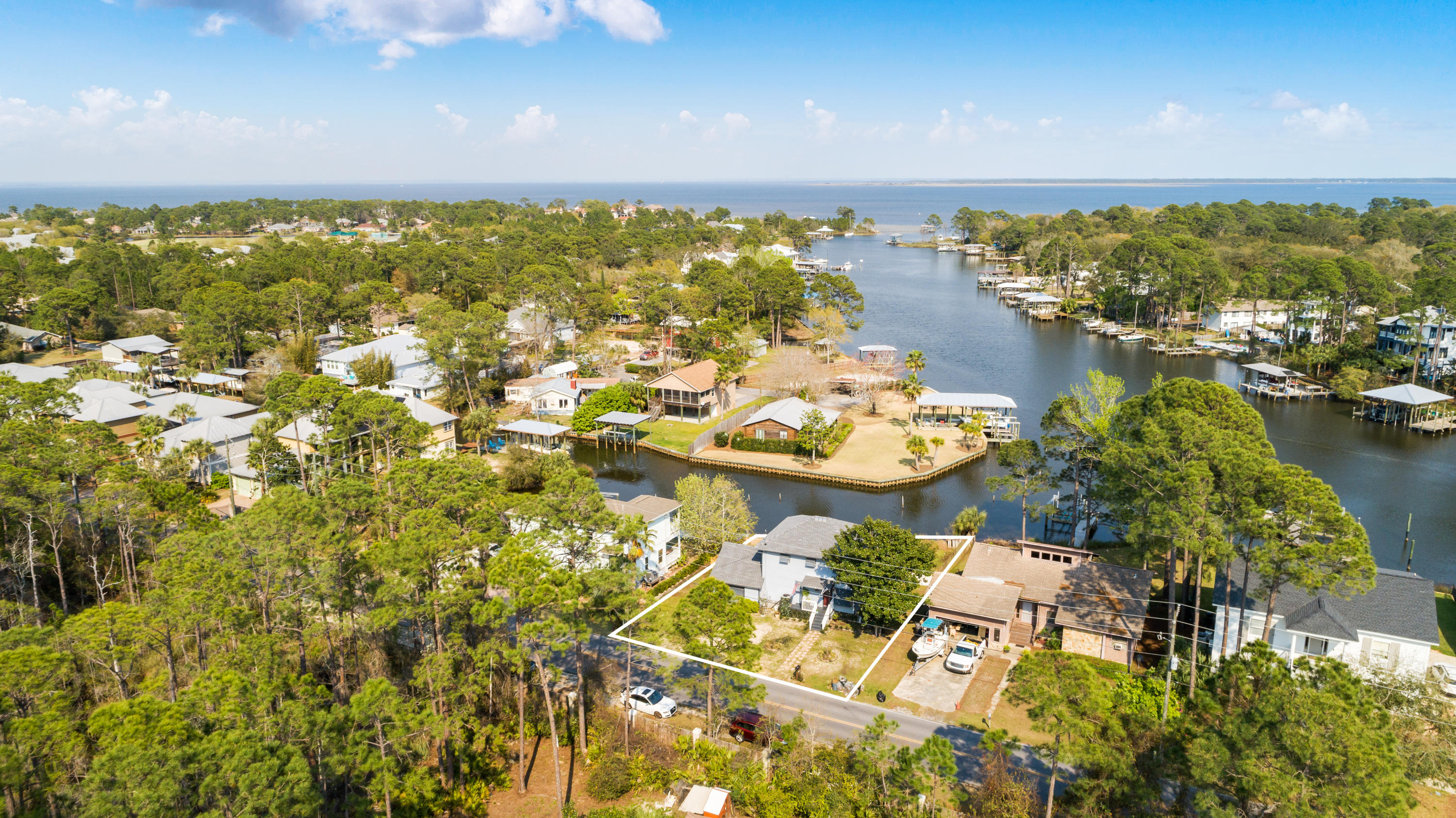 Deep water access on the Choctawhatchee Bay! With over 85 feet of bay frontage on Buck Bayou in Santa Rosa Beach, FL. This 1692 SQ FT Bayfront home is primely situated on .17 acres with a garage, deck, and spacious back yard with an opportunity for a deep water dock with boat lift. New appliances and fresh kitchen updates flow seamlessly into living dining combo with abundant natural light that flows in from large bay facing windows. Master includes bump out windows overlooking bay and abundant natural light. New Roof in 2019 and New AC in 2018!Great opportunity for bay living!