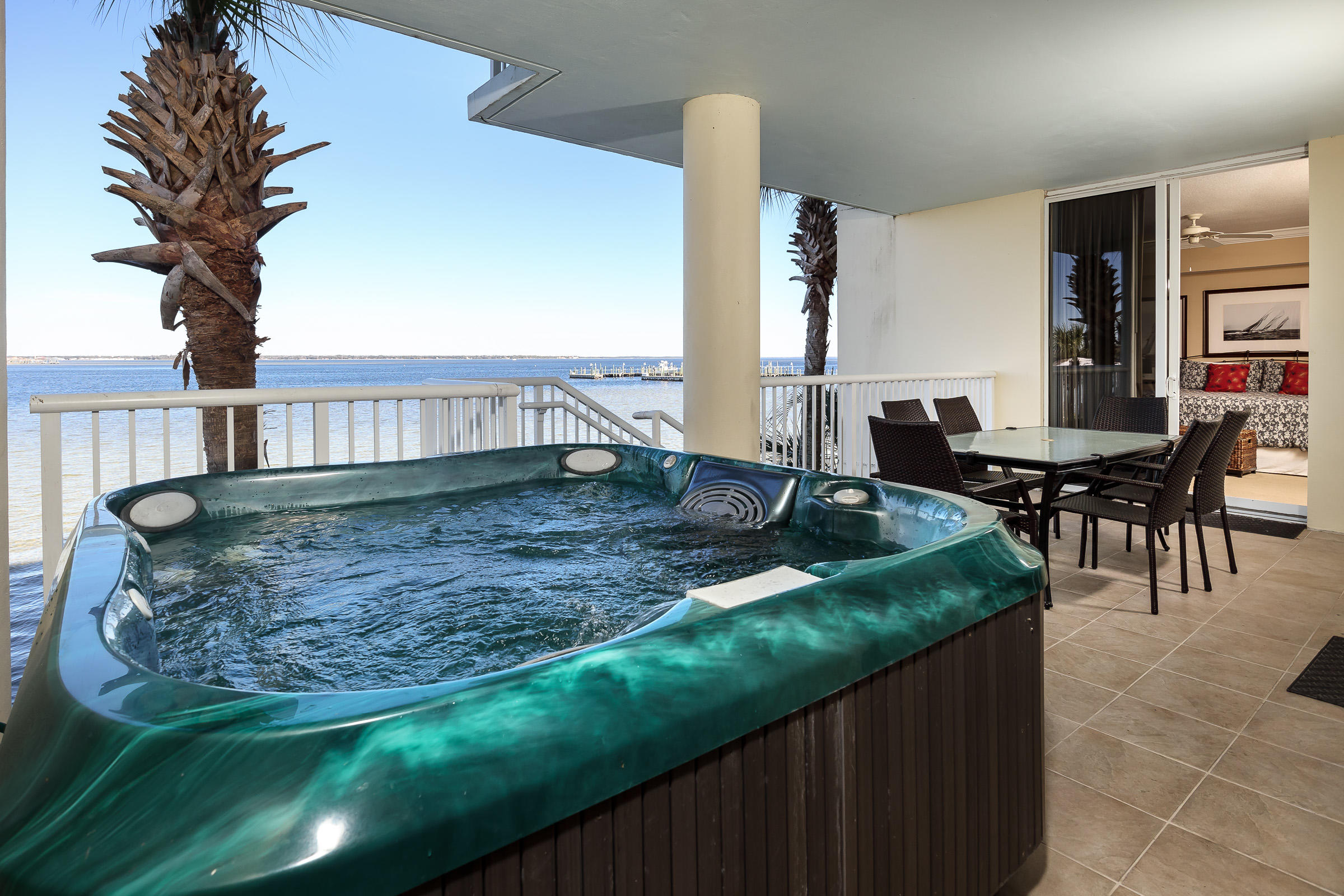 FULLY FURNISHED AND RENTAL READY! This gorgeous 3 bedroom condo with its own private hot tub and garage is a rarely listed Lanai unit at Destin West Beach and Bay Resort, one of the most sought after rental destinations on the Emerald Coast. With net rental revenue in the $65,000 range year after year, this spacious condo in this magnificent complex located directly the Choctawhatchee Bay has views that will take your breath away. With Heron's private heated pool, courtyard surrounded by an Award winning zero entry Lazy River pool, heated waterfall swimming pool, two large Jacuzzi hot tubs and amazing lush landscaping. With access to the Gulfside by use of an elevated Sky Bridge over Hwy 98 and the Gulfside Beach and amenities,