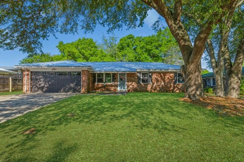 Welcome home to this quaint 3 bed, 2 bath 1,460 sq ft home that is just 3 miles from Hurlburt Field front gate, and steps from the Choctawhatchee Bay/public Boat Launch/Mary Esther City Fishing Pier! This home is perfectly situated on a mature lot with large live oaks on a quiet cul de sac. Enjoy the private fully fenced backyard that is home to a 20' x 16' electrically powered shed/workshop! With NO HOA or Deed Restrictions, one may enjoy the convenience of having their boat or RV on property AND still have space for a pool in the backyard! This home proudly displays a new metal roof replaced in 2021,New HVAC 2022, a new insulated double garage door with impact glass in 2021, 6 of 10 (all front windows) replaced, and water heater replaced in 2016! FLOOD ZONE X, NO FLOOD INS REQUIRED