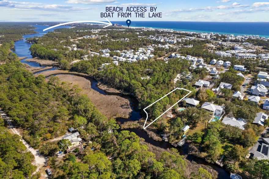 This exceptional half-acre lot in North Inlet Beach offers a rare opportunity to create a waterfront retreat with direct access to the gulf via Lake Powell. . With 86 feet of pristine lake frontage, the possibilities are endless -- imagine building a custom home designed to take full advantage of breathtaking views while enjoying the convenience of launching a boat, paddleboard or kayak right from your backyard.  Located just minutes from the sugar-white sands of the gulf and the charming community of Rosemary Beach, this property is surrounded by an area known for its scenic beauty, upscale shopping and world-class dining. Whether you're looking to design a serene private residence or an investment property, this location