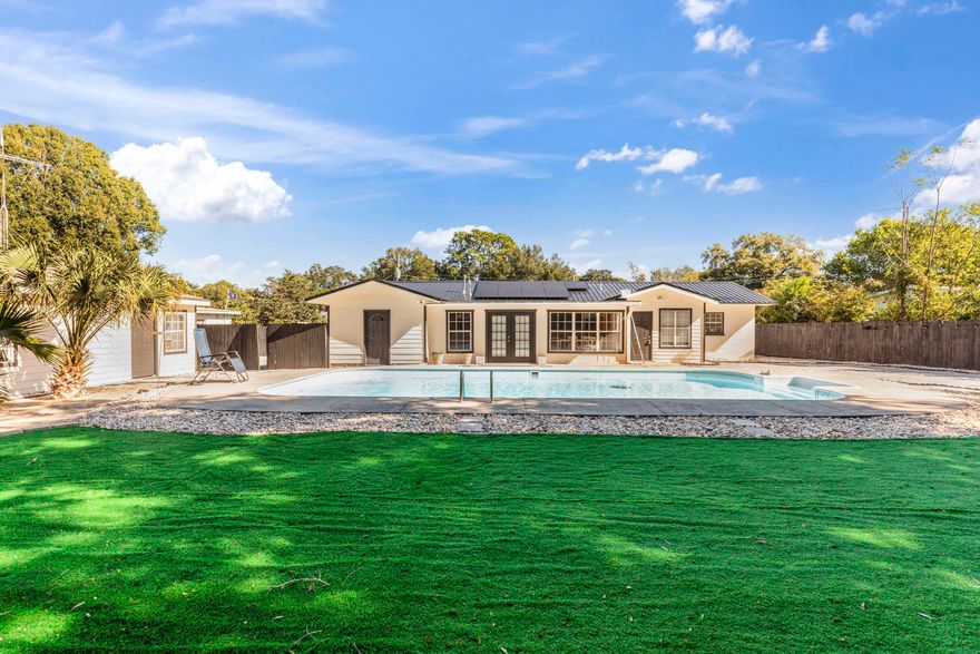 Interested in purchasing a primary home with a POOL that allows you to 'house hack' the second unit? With over $120,000 in improvements, the effective year is 2005. Minutes away from Ferry Park, military bases, and downtown! Solar panels will be PAID OFF at closing. This home is very versatile and offers RV/boat parking with gray water/electrical hookups, jet ski/kayak parking, a mother-in-law suite with full bathroom, and a large shed in the backyard with electricity! Enjoy with all the backyard vibes and the perfect setup on a warm Florida day. The home was completely rewired. The sellers installed a NEW roof, privacy fence, pet-friendly turf, fire pit, and new driveway. New flooring coming soon! Don't miss out on your next cash flowing venture! Reach out and schedule your showing today