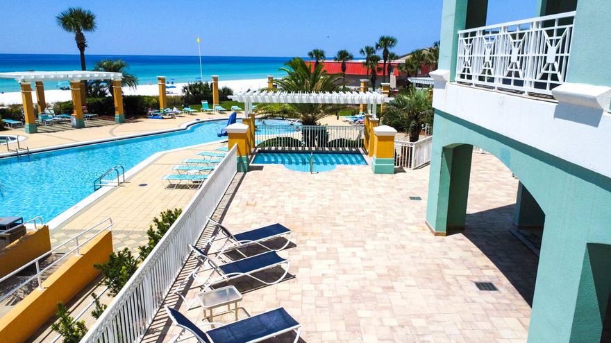 NEW PRICE ADJUSTMENT - GULF-FRONT PENTHOUSE! Welcome to your dream first-floor penthouse condominium at 7505 Thomas Drive, PH 121G, nestled within the En Soleil Condominiums of Panama City Beach, FL. This remarkable, fully furnished residence features 5 bedrooms, 4 full en-suite bathrooms, and spans 3,079 square feet of thoughtfully designed living space. Adding to its allure, an expansive 1,700 sq. ft. terrace boasts a private pool, outdoor kitchen, and stunning panoramic views of the Gulf, offering a total of 4,779 sq. ft. of coastal living.Inside, the split floor plan ensures privacy, with the primary suite and other bedrooms located on opposite sides of the penthouse. The lovely French country-inspired primary suite offers a spa-like bathroom with a jetted tub, a large walk-in shower and two spacious walk-in closets, along with a vanity area. Floor-to-ceiling windows flood the residence with natural light, enhancing the already breathtaking views.

Step outside to your brand-new 16x10 heated pool, situated on your oversized private terrace. This area features an outdoor kitchen with a grill (2022) and a partially covered lounging/dining area, making it ideal for both entertaining and relaxing. The open-concept interior kitchen includes an eat-in bar, new refrigerator, wine refrigerator, custom cabinetry, granite countertops, and two dining areas, creating a perfect setting for family gatherings. The open floor plan creates a seamless flow between the living, dining, and kitchen areas, ideal for hosting guests and enjoying indoor/outdoor living and entertainment. The terrace provides spectacular views of the turquoise waters along the Emerald Coast, perfect for enjoying your morning coffee or sunset cocktails.

Recent upgrades include new Cat-5 hurricane-rated windows and sliding glass doors (2023), new HVAC systems (2024), new baseboards and crown molding, new blinds throughout, a new exterior patio tile border, and a recently painted exterior privacy terrace fence. Additional upgrades include new over-counter kitchen pendant lights, a new fireplace, 7 new smart TVs, and a new refrigerator inside the private deeded storage room.

This penthouse not only provides a stunning retreat but also offers strong rental income potential, with projections of up to $150,000 annually. Designed to attract guests with its breathtaking Gulf-front views, resort amenities, and unparalleled privacy and security, this property stands out as a prime investment opportunity.

Residents of En Soleil Condominiums enjoy top-tier amenities, including 24/7 security, private beach access with beach chair setup, resort-style pools, an on-site fitness center, conference room, and covered garage parking. The two 15-story towers, with just 2-3 condos per floor, offer exceptional privacy and space. Enjoy your expansive Gulf-view terrace and the convenience of underground parking, complete with your own deeded space and direct elevator access to climate-controlled vestibules, ensuring comfort in any season. This gated private community, with only 88 units, is also renowned for its meticulously maintained grounds.

En Soleil is just moments from world-class golf, sport fishing, gourmet dining, and boutique shops. This resort boasts over 6,500 square feet of stunning swimming pools, two beachfront hot tubs, and striking waterfall features, along with 450 feet of private sugar sand beach. From the pool deck, just follow the private beach walkway to your special place in the sun. En Soleil is unlike any resort you have experienced before!

Don't miss this rare opportunity to own a penthouse at En Soleil Condominiums - Schedule your private showing today!