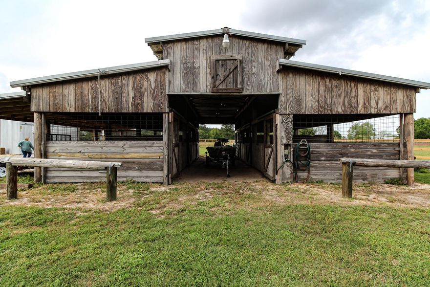 This little piece of heaven is country living at its best! Don't miss out on this beautiful 3 bed 2 1/2 bath brick home on 3.57 acres with a shed, shop/hang out, and a barn with 6 stables. Once inside the home you will see the new lvp flooring in the main living space, and new carpet in all the bedrooms. The brick fireplace in the living room is a showstopper, cozy up with a fire on those cold winter nights.  The house has a lot of charm and has so much potential to become someone's dream home. On the outside is a brand-new brick mailbox across street. In the back is a brand new well, pump, and pump house. The shed, shop, and barn have all been wired by Casey electric and all have running water also. Enjoy the beautiful vineyard with 5 different grapes and multiple kinds of fruit trees.