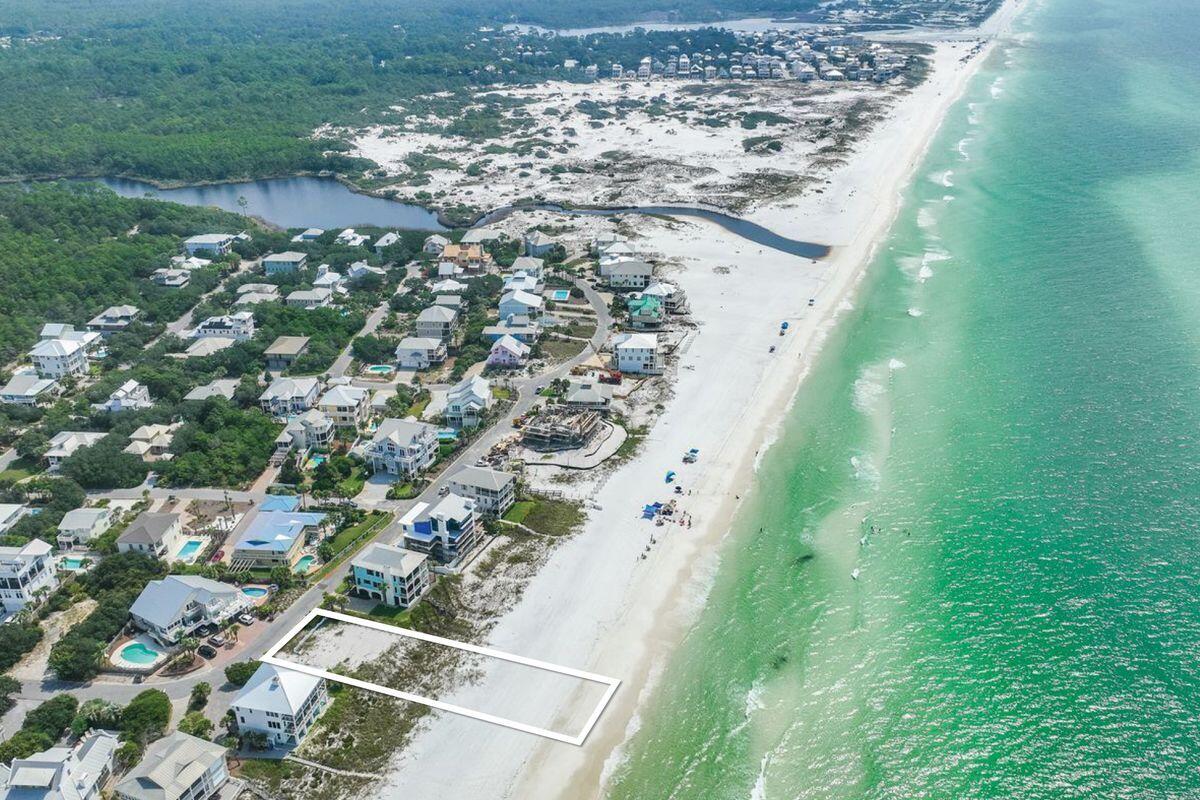 Nestled in the secluded community of Gulf Trace in Grayton Beach, this expansive lot boasts an impressive 80 feet of gulf frontage, extending right down to the waterline. Imagine waking up to the soothing sounds of the gulf, just steps away from your doorstep. With house plans available for a unique 3,577-sq.-ft. duplex -- each side featuring its own petite pool and connected solely by stairs -- your investment choices are flexible. Opt to build the duplex or go the route of a single-family home; either way, you're constructing a lifestyle that's the epitome of coastal luxury. This rare lot is situated in a tight-knit neighborhood consisting of only 82 homes, making it a tranquil enclave in a much-desired locale. Gulf Trace is uniquely bordered by Grayton Beach State Park and scenic coastal dune lakes on three sides, creating a serene natural buffer that enhances privacy and tranquility. Convenience isn't compromised for seclusion; you're within walking distance of everything Grayton Beach has to offer. Whether it's shopping, dining, or entertainment, it's all easily accessible. This is one of only three lots offering such extensive linear footage along the gulf across the entire 30A corridor, elevating its exclusivity. Here, you're not just buying land; you're securing a coastal paradise.