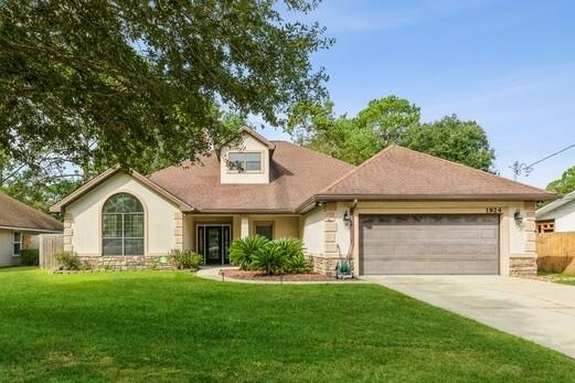 Welcome to this beautifully updated move-in-ready home. This custom 3-bedroom home boasts 2 flex rooms that would be perfect for dual offices, working out, or hobbies. Entering your eyes will be drawn to the beautiful floor to ceiling stone fireplace. Walking into the great room you will notice the gorgeous peaked tongue and groove ceiling with exposed beams. The Kitchen has Silestone counters with new stainless-steel appliances including a gas range and raised dishwasher. The solid cherry cabinetry completes this well-appointed kitchen. The very spacious Master Bedroom feels like a retreat with its trayed ceiling finished in crown molding and solid wood wainscoting. The crown molding continues into the Master bath which has been updated with new fixtures, lighting and shower door.