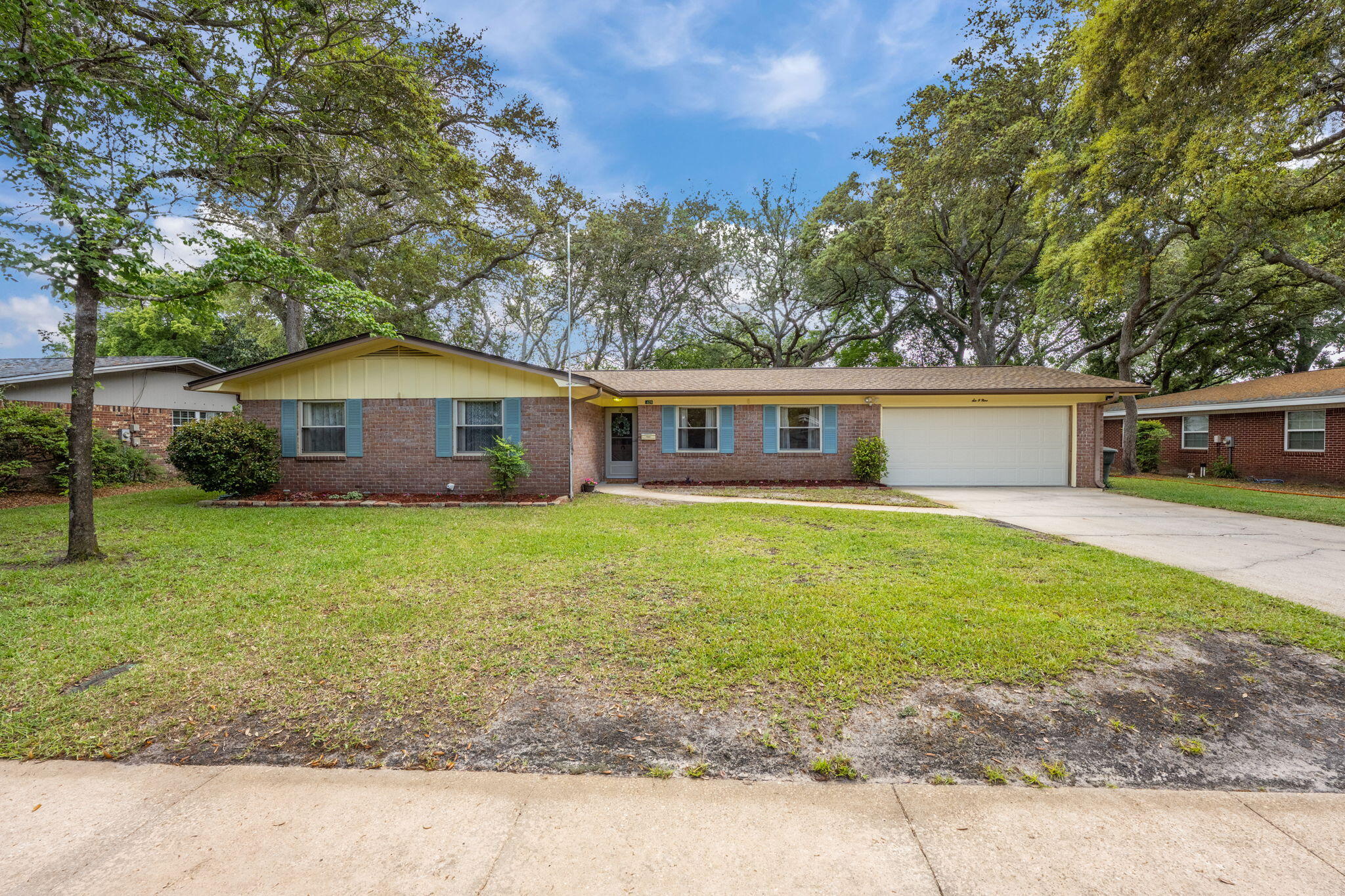 Welcome home to this beautiful, brick single-story 4 bedroom/2 bath located in the highly sought-after Kenwood neighborhood. Fenced back yard, mature trees and mid-century charm create a great place to call home. The formal living room is large and there is a second sitting area near the dining room and kitchen. There are sliders from the dining room and the master bedroom that open to a 25 x 8 Sunroom with functioning screen windows to enjoy cooler spring, fall and mild winter weather. The kitchen has a breakfast bar and a window over the sink that overlooks the backyard. Three bedrooms share the full hall bathroom, and the master bedroom has an ensuite with a tiled shower. New water heater 2025! New roof 2023! Double pane windows. HVAC Dec 2021; HVAC parts warranty through Dec 2026 A fantastic location conveniently situated between two military installations: about 9 miles to Eglin Air Force base or Hurlburt field. About 6 miles to the sugar white sandy beaches of Okaloosa Island. Near to schools, shopping, golf/tennis/pickleball and medical facilities. The neighborhood has a lot to offer. This is the place you've been waiting to call home. Don't miss out on this fantastic opportunity in Kenwood.