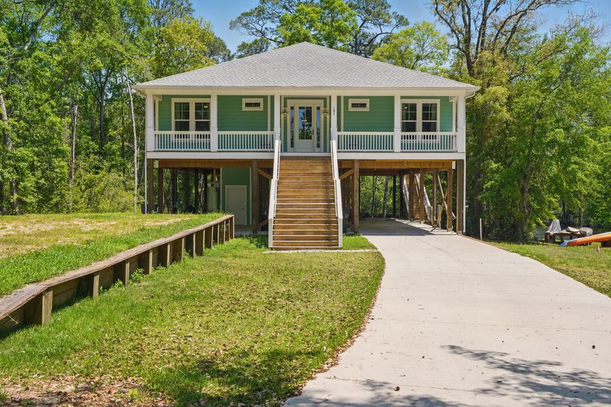 Architecturally designed and custom built in 2023 by Ralph Laird, this one-of-a-kind waterfront home sits on deepwater Alaqua Creek. Easy access to the Bay.  Elevated on pilings with a built-in elevator, it offers both peace of mind and convenience. Inside, an open-concept layout connects the living, dining, and kitchen areas under soaring ceilings with expansive creek views. A custom breakfast bar and large windows invite light and conversation. Outdoors, enjoy a covered porch and elevated deck--perfect for relaxing or launching bay-bound adventures. With 3 bedrooms and 2 baths, every inch blends thoughtful design with natural beauty.  Excellent fishing! Alaqua is famous for bream, bass, red fish & speckled trout! shown by appt. 24 hours notice