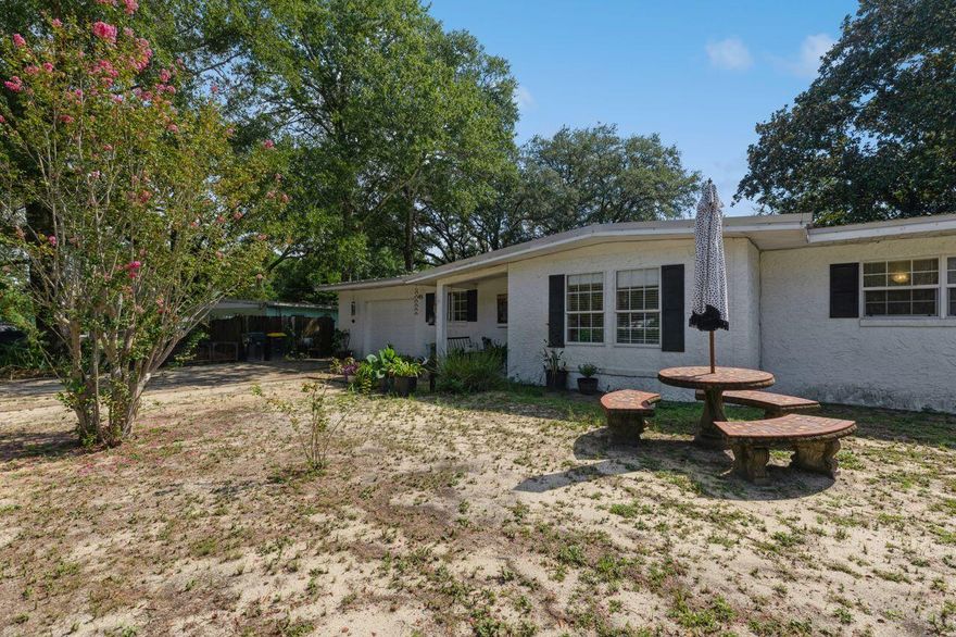 Florida Cottage in sought-after Elliott Point.  The interior was remodeled in 2018 at this adorable concrete block house with metal roof. The kitchen features concrete counters and subway tile backsplash with a stainless steel appliance package (refrigerator, stove and oven) also new that year. The flooring is tile throughout the living spaces and carpet in the 3 bedrooms. Home's electric has been upgraded to copper wiring.  The backyard is huge, level and fully fenced. The 1 car garage has extra storage space. Washer/dryer hookup located in storage area of garage. Plenty of driveway space for your boat or RV. Great location, just 1/2 block to the entrance of Ferry Park with paths, tennis courts, frisbee golf course, and more.call today to schedule a private tour. Don't wait! This wont last long! Great Price! Call for a private showing.
