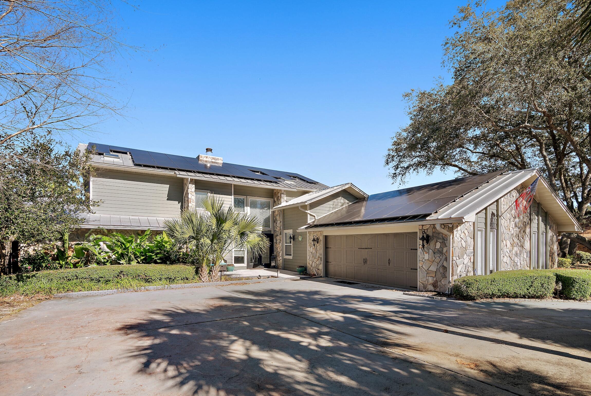 Discover waterfront elegance in Indian Bayou, Destin's hidden gem! This 4-bedroom, 4-bath sanctuary offers not just a home but a lifestyle. Imagine waking up to serene bay views, visible from your renovated, open-plan kitchen--perfect for hosting. Step outside, and your private oasis awaits with a heated pool and breathtaking views of Indian Bayou, a haven for dolphins. Your deep-water bayou frontage is a boater's paradise, complete with a dock, boat lift, and jet ski lift. Revel in the Florida sun with solar panels and a full-house generator for uninterrupted comfort. The primary suite, conveniently located downstairs, is your tranquil retreat. With low HOA fees, a neighborhood golf course, clubhouse, and only 2 miles to the beach, life here is as convenient as it is luxurious. Plus,