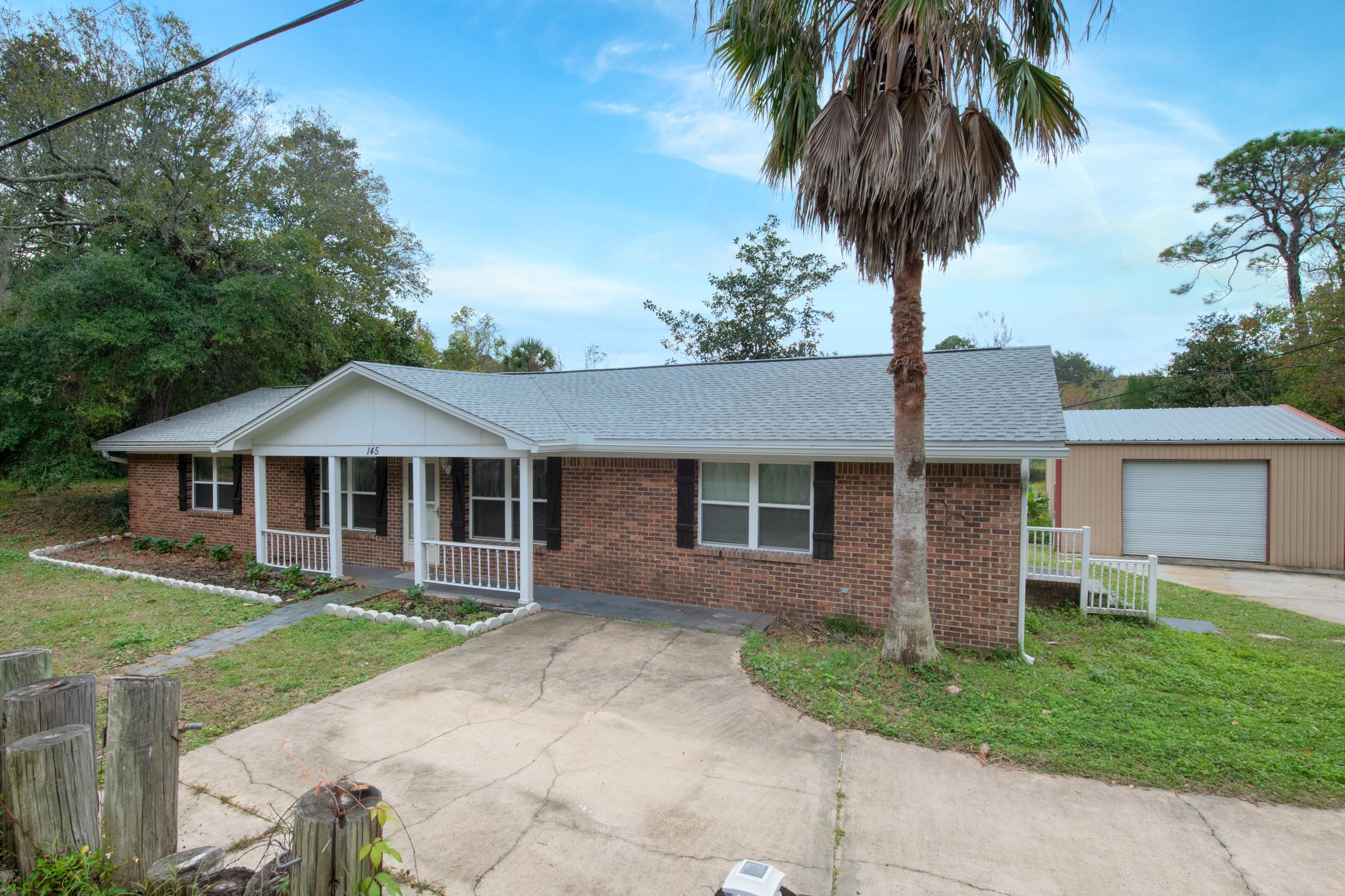 This classy 4 bedroom 2 bath home is centrally located and sits on over a 3/4 acre lot with a doc. The kitchen has been updated with stainless steel appliances and an oversized breakfast bar. The dining room and master suite lead out to an updated sun room and large open deck. The spacious garage\workshop provides space for parking and storage. The dock is located right on Gap Creek and has room for a small boat or jet ski. Just a short commute to Hurlburt Field, Eglin AFB, shopping or the Beaches.